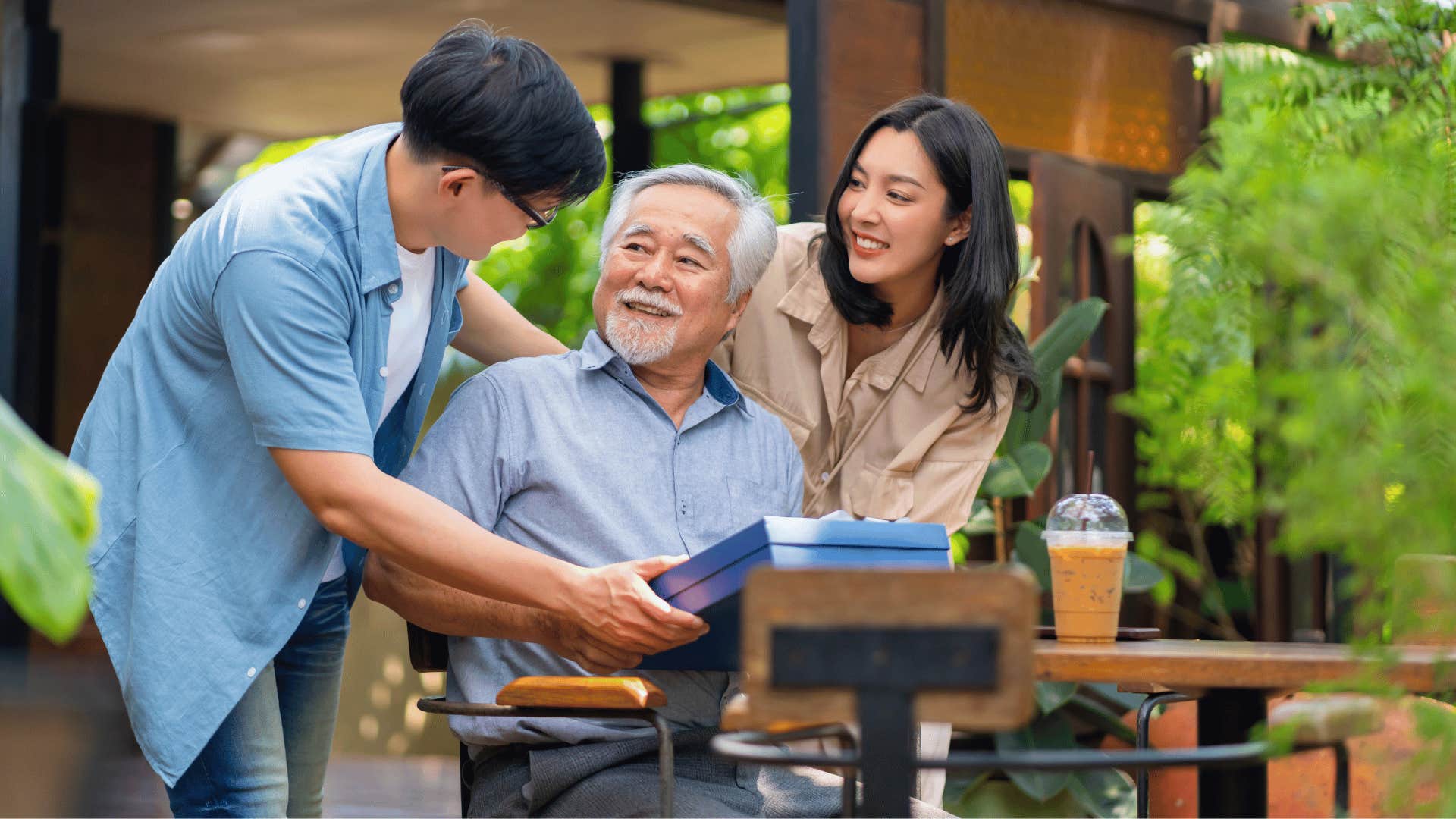 husband and wife visiting older man