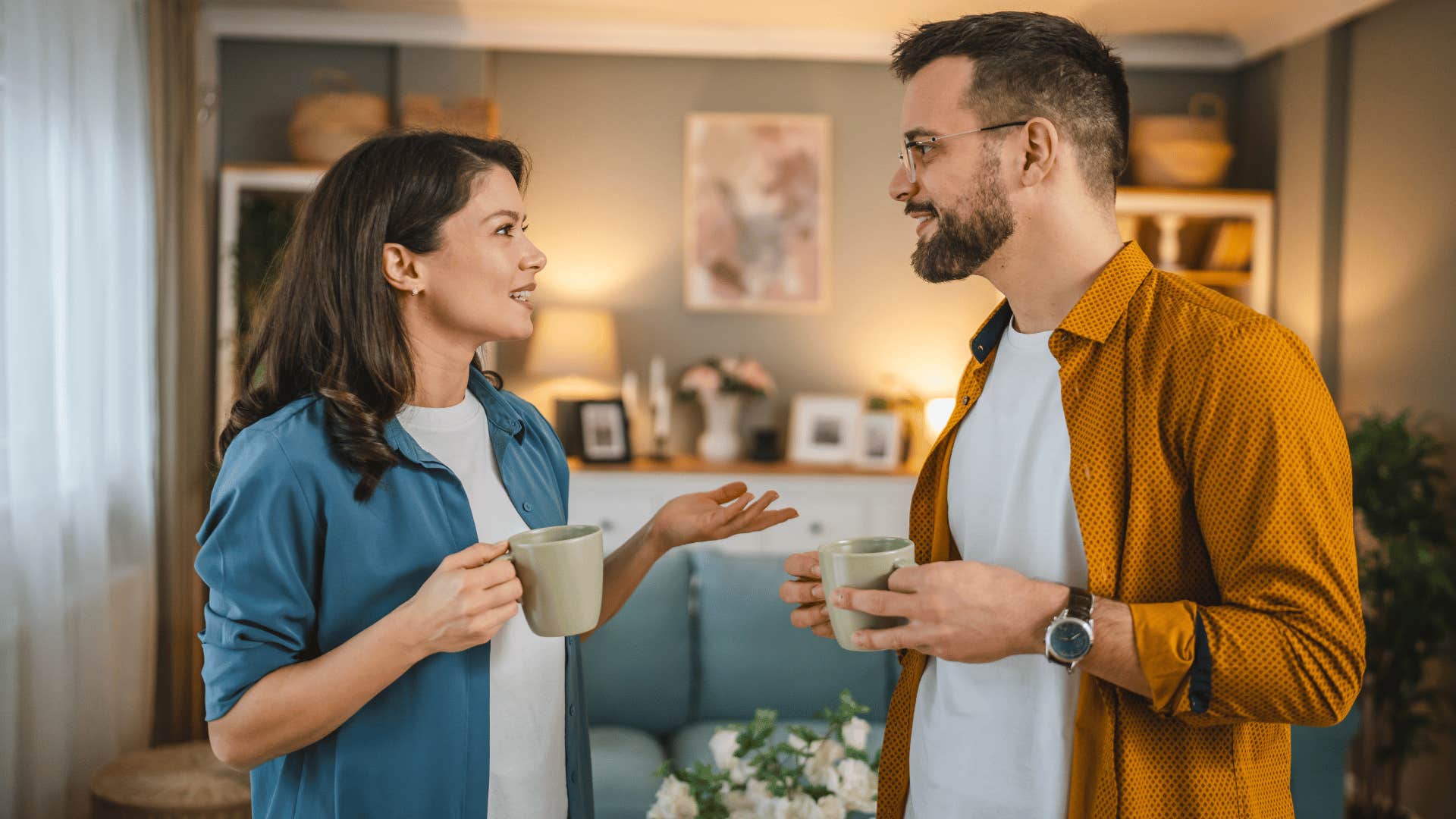 wife asking husband about his day over coffee