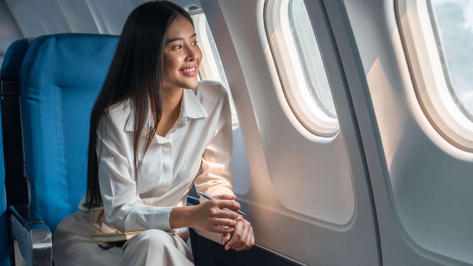 happy woman on an airplane