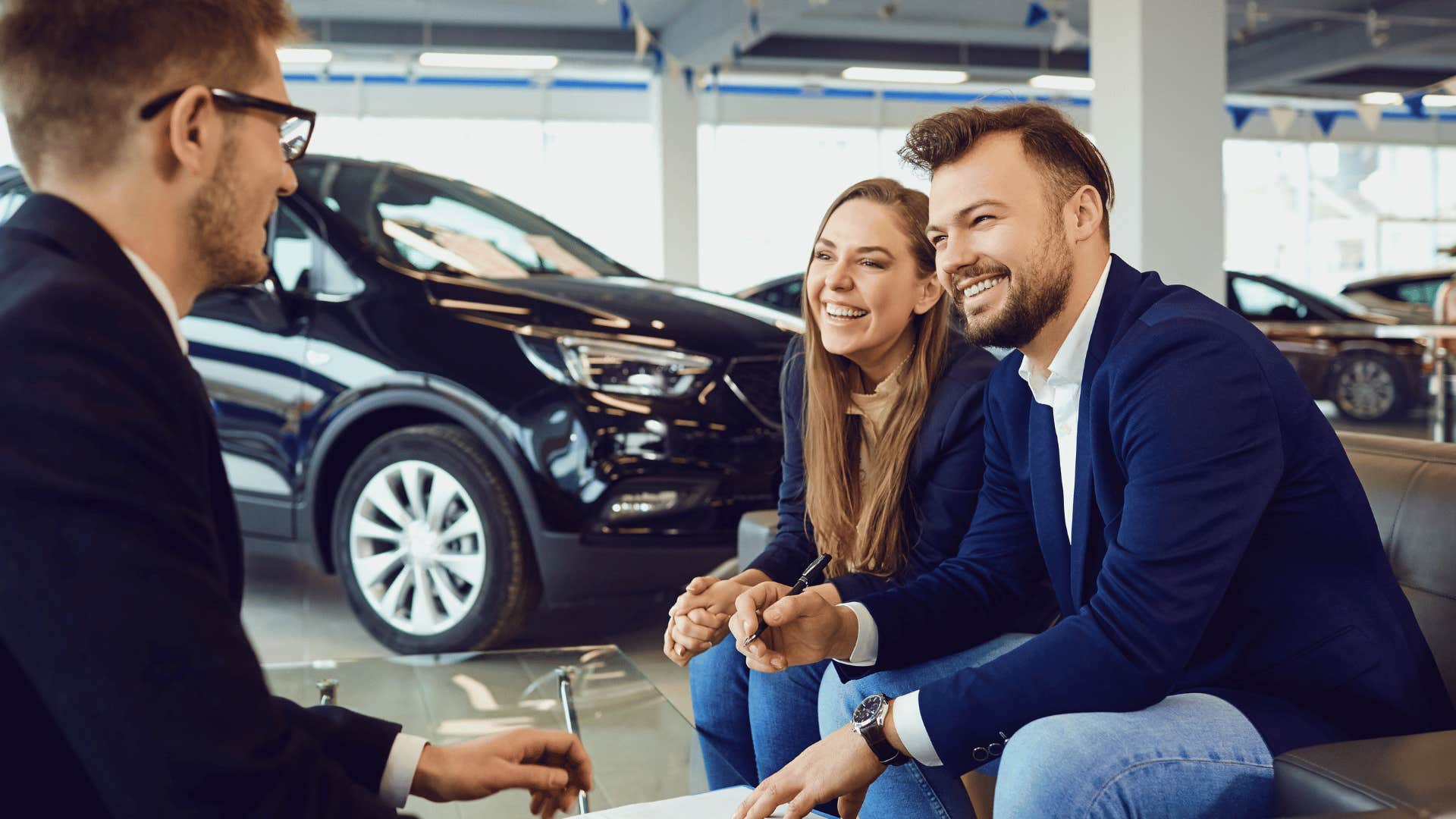 middle class couple shopping for a car