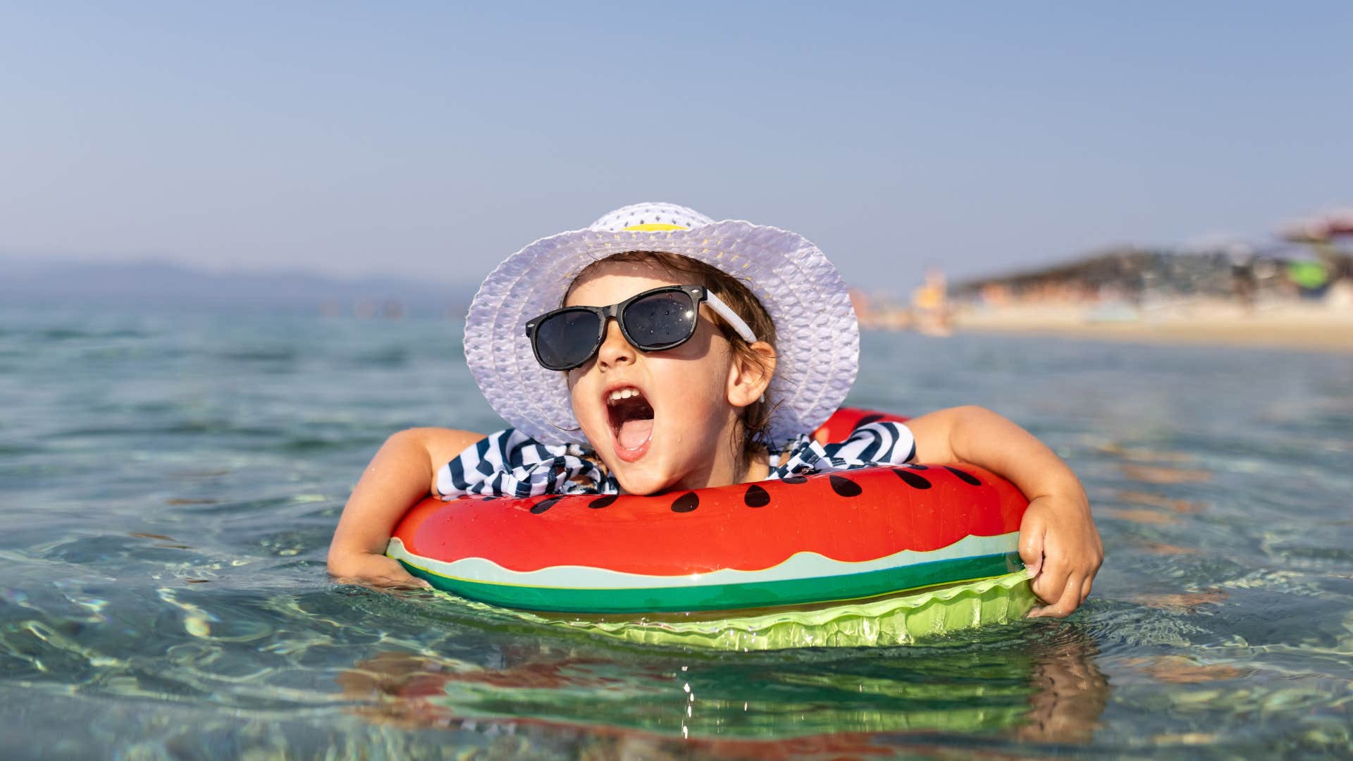 child yelling on a floatie