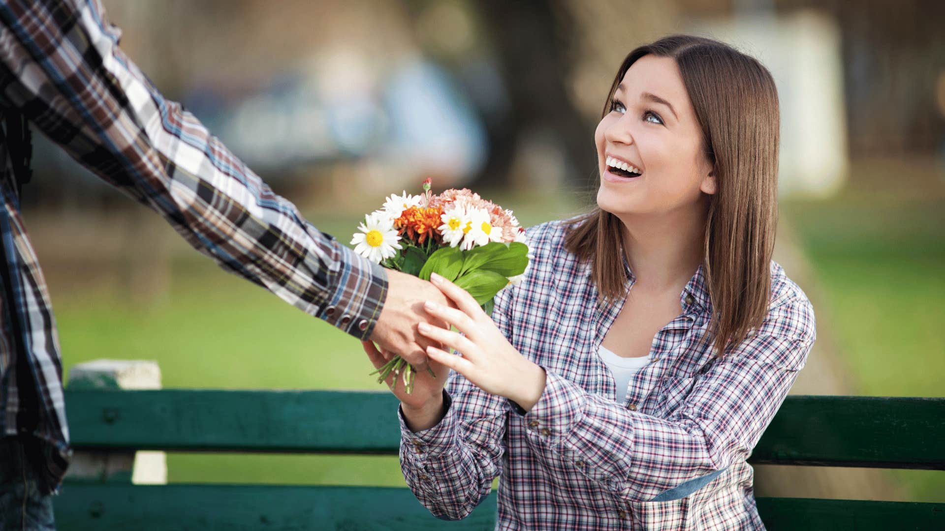 a truly loving husband gifting his wife flowers