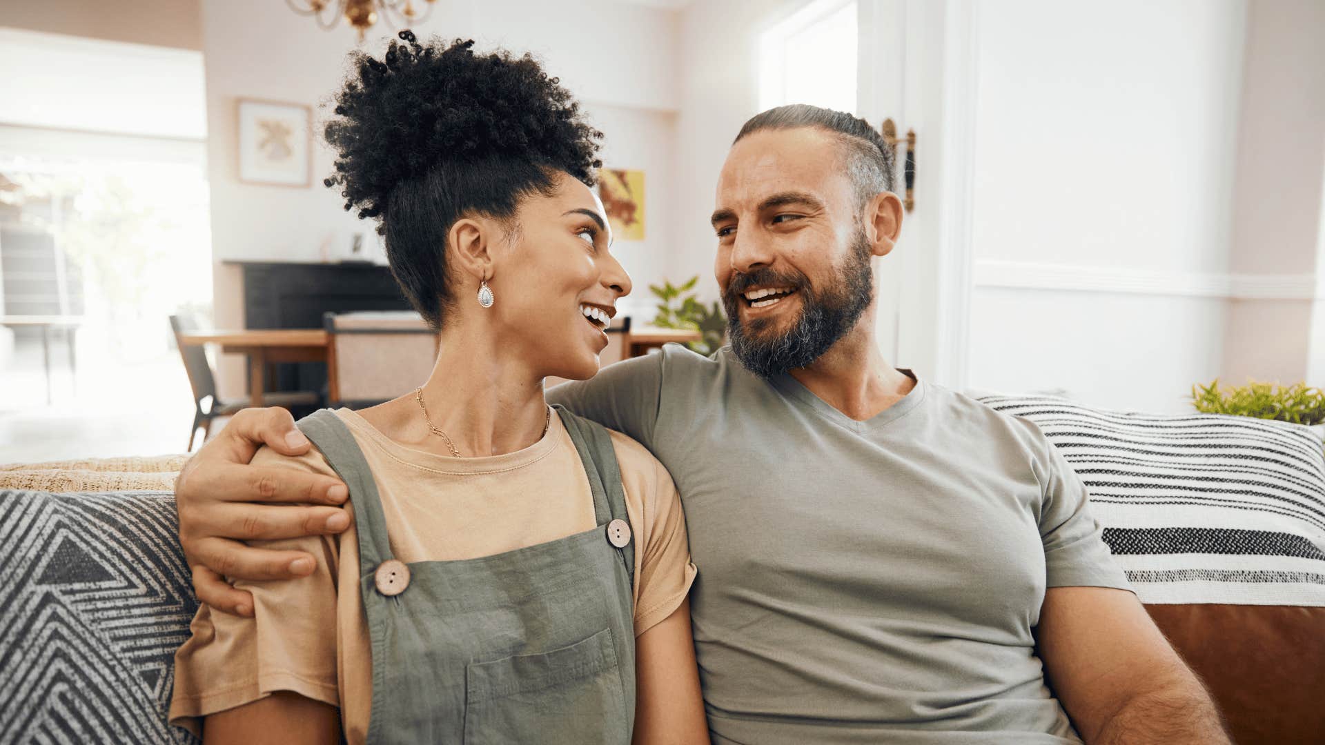 Supportive couple smile and embrace in happy marriage