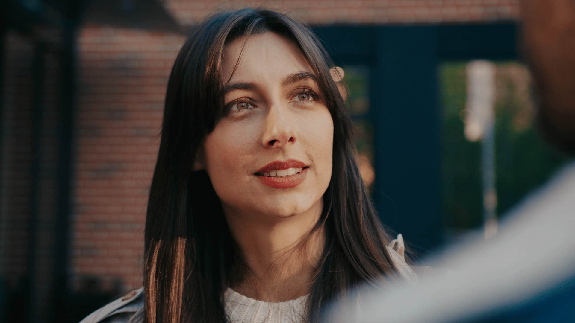 woman paying close attention to someone speaking