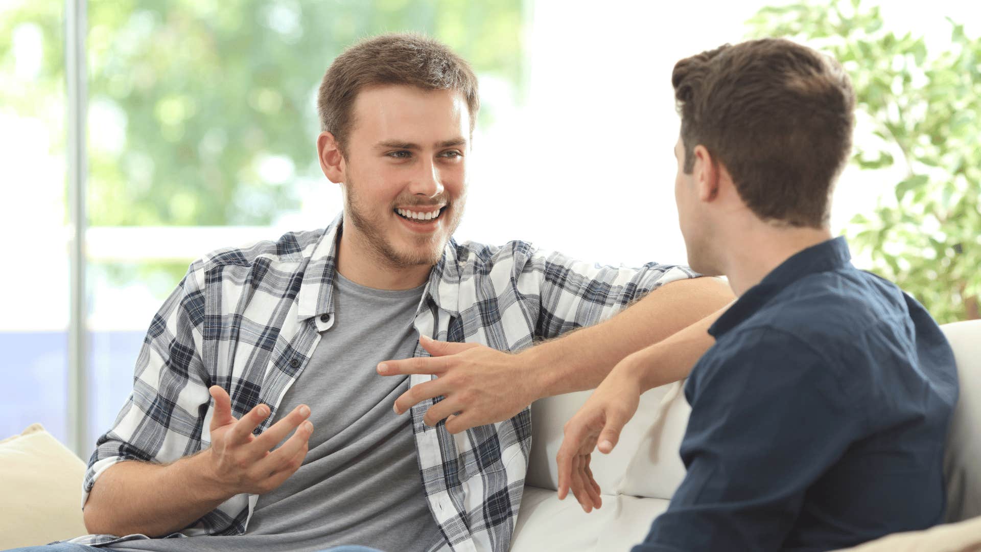 man talking to other man