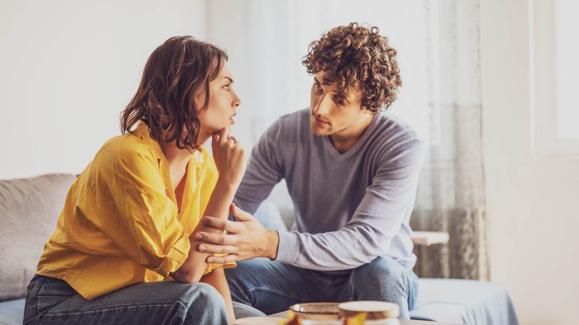 man apologizing to woman