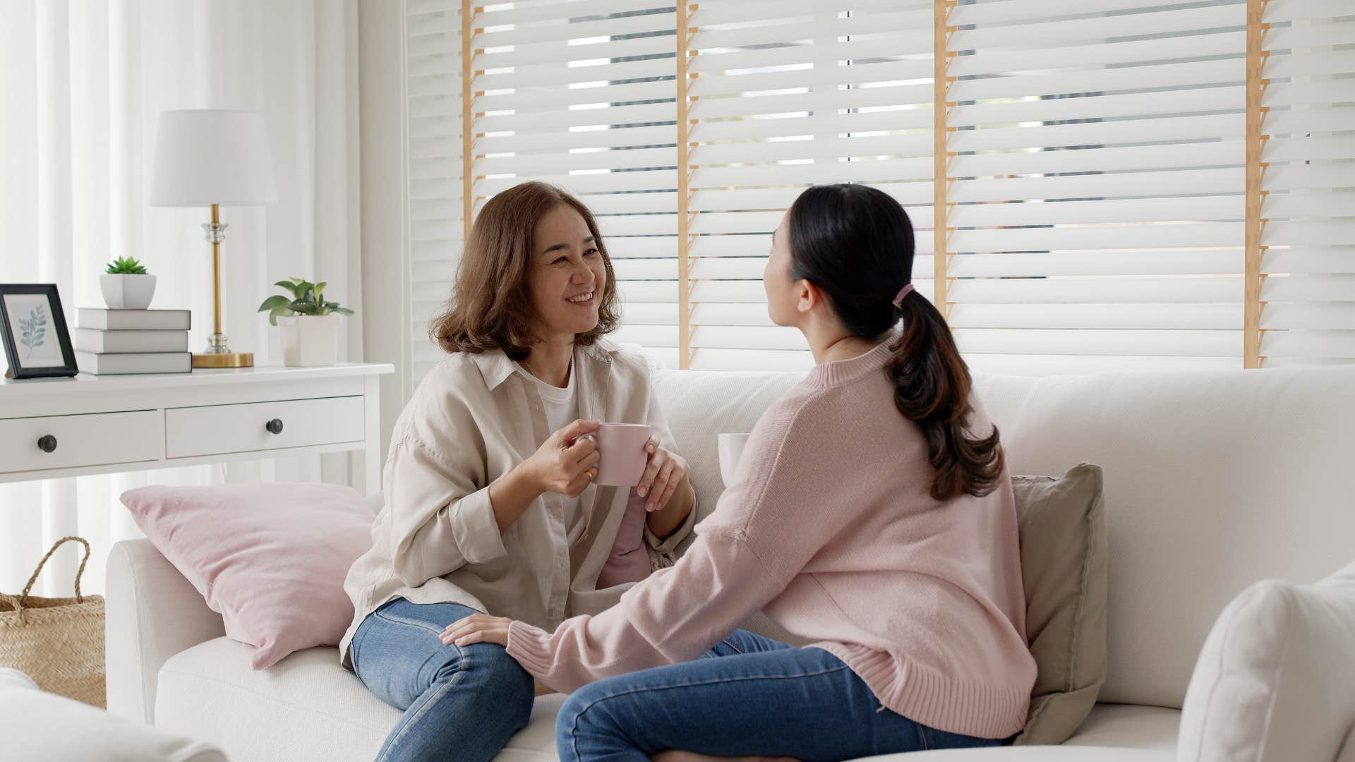 young and older woman talking together