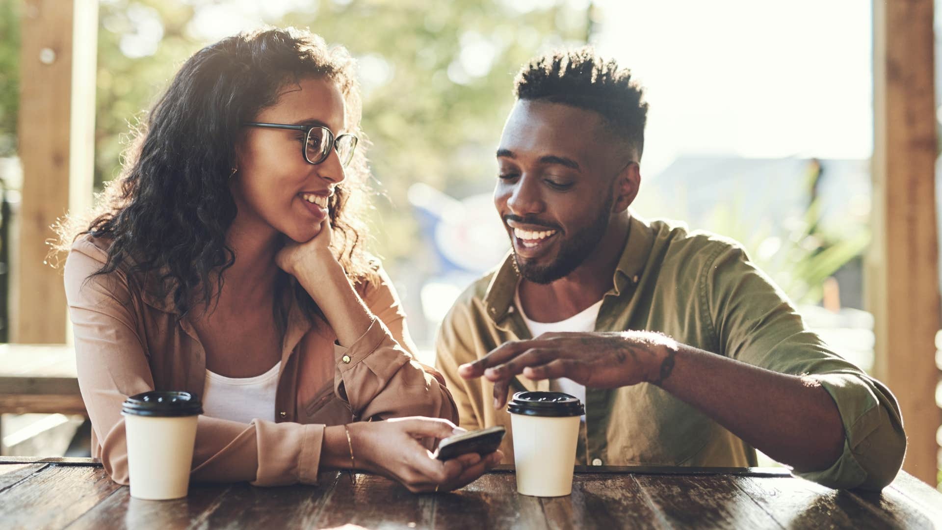 man leaning in towards woman