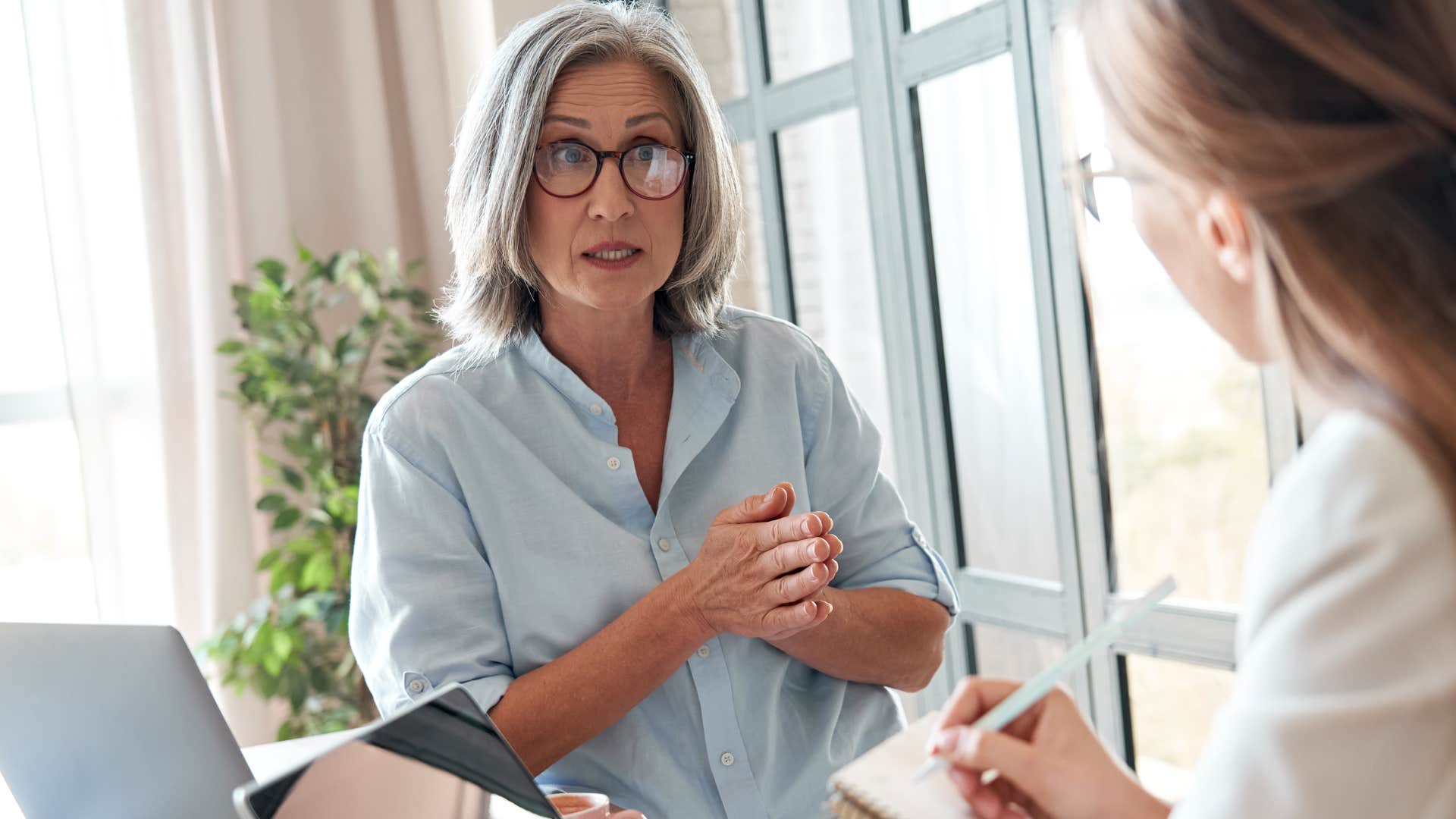 woman with closed off body language