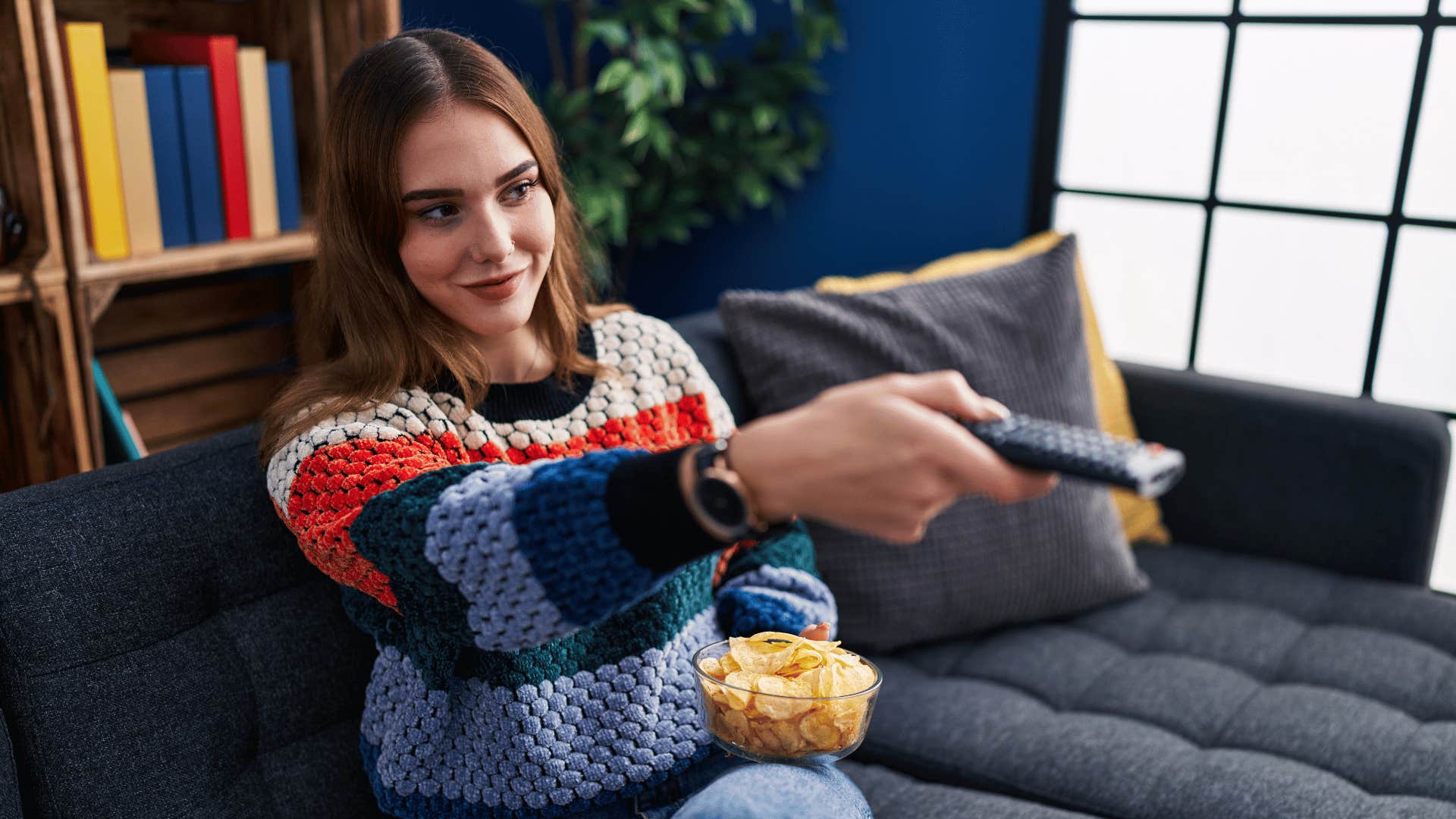 woman with tv remote