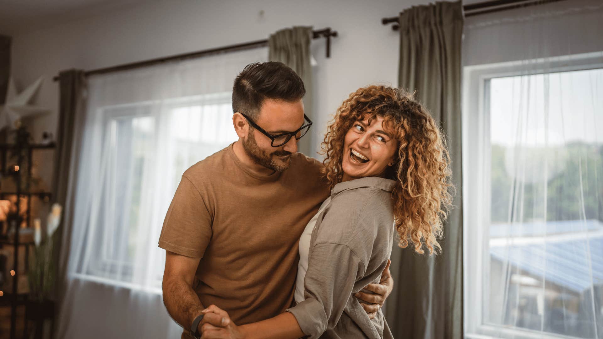 couple dancing in living room