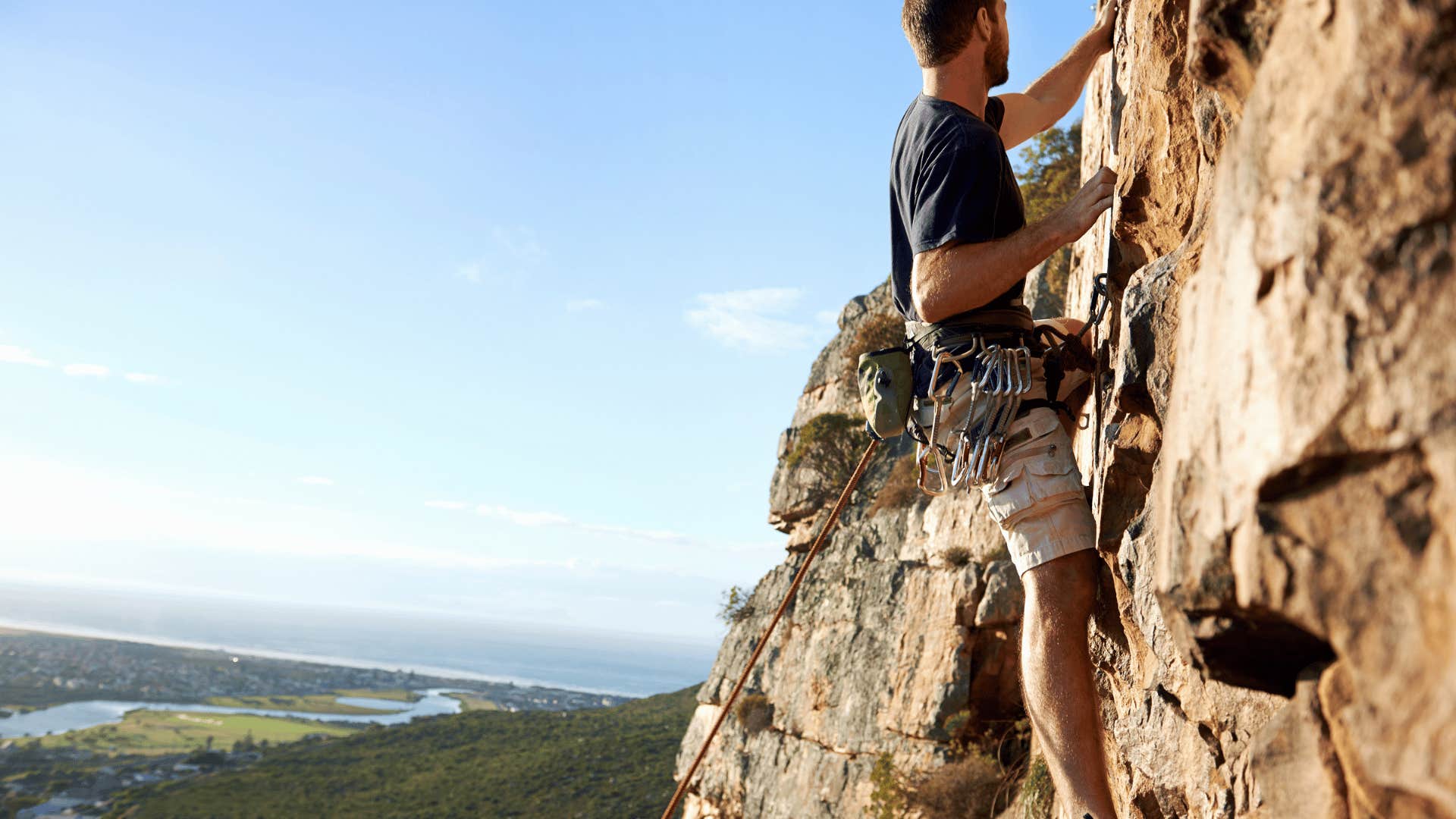 man rock climbing outdoors