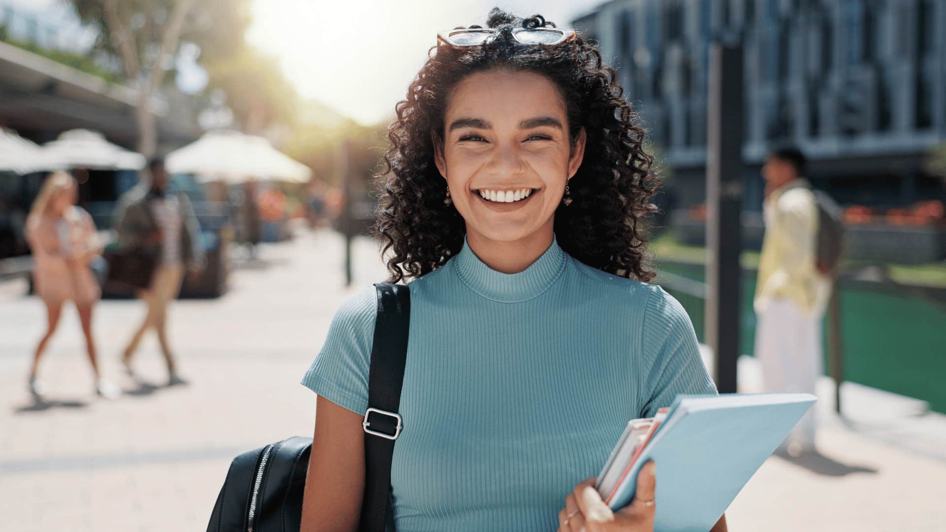 woman smiling on college campus