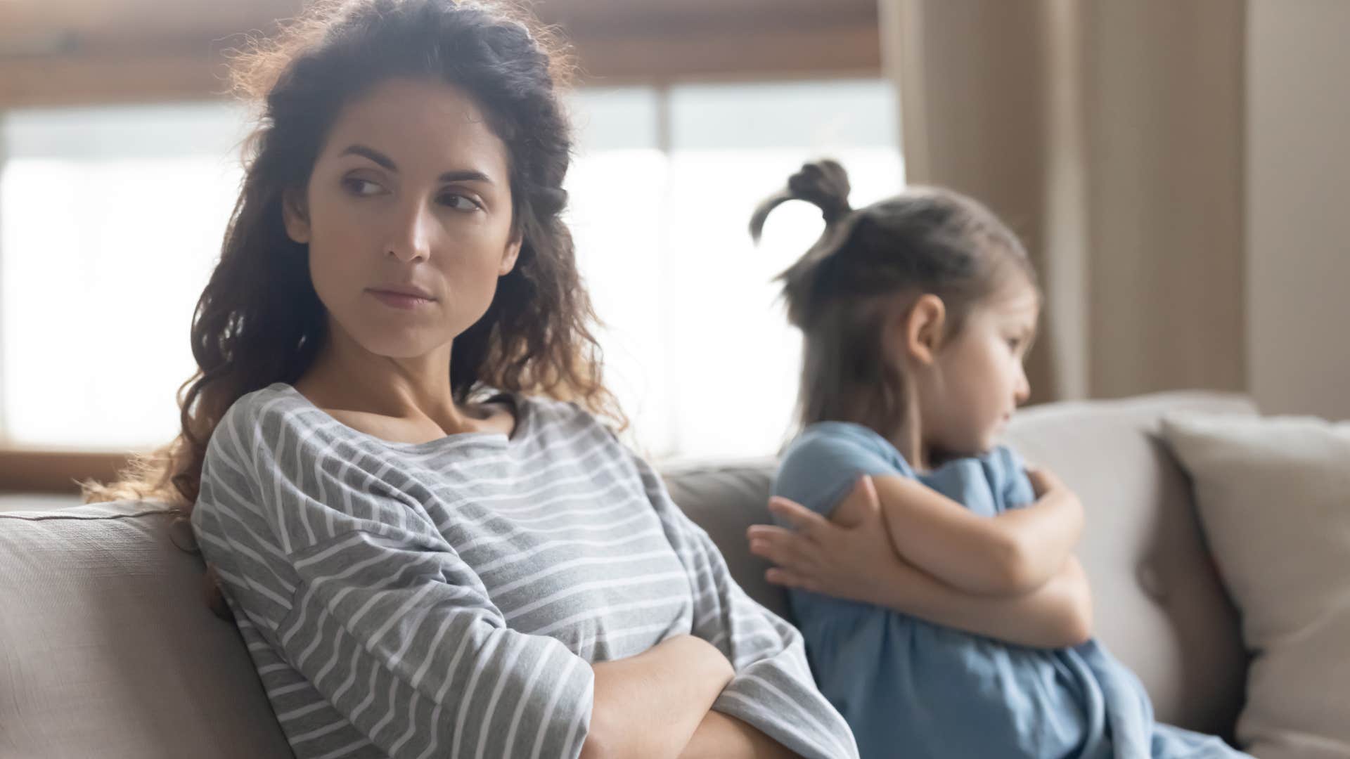 mom turned away from her upset daughter