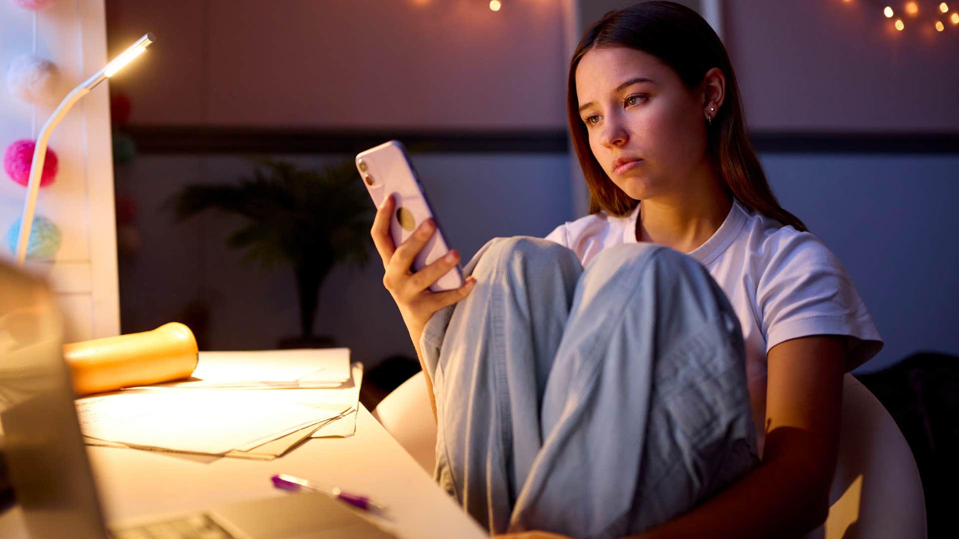 relaxed teen on her phone