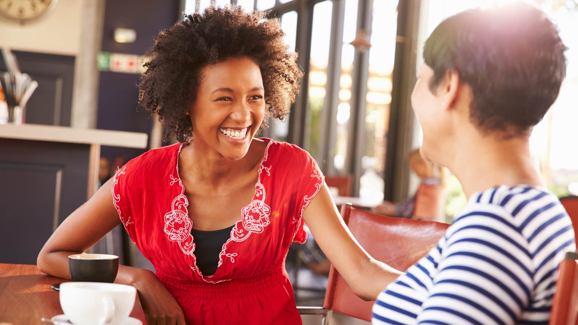 high value woman smiling and talking to her friend