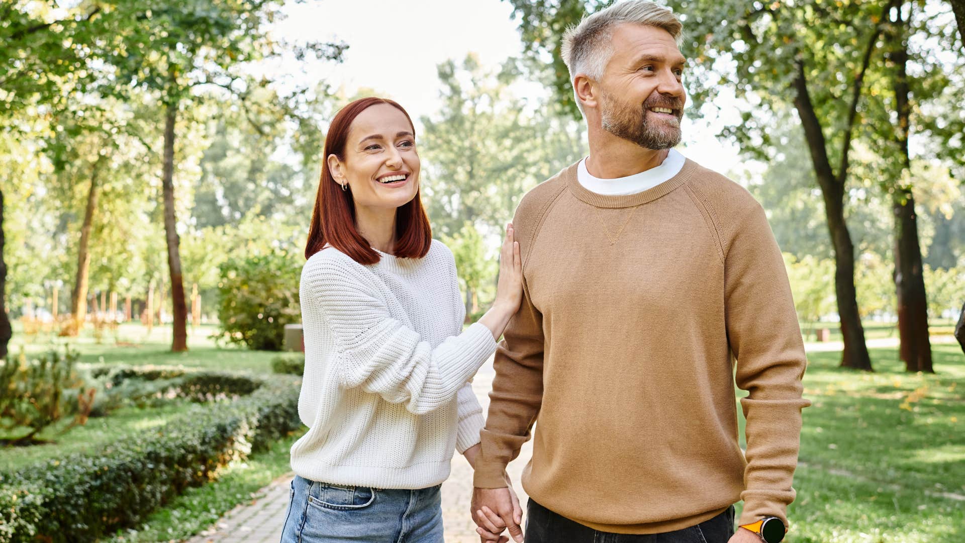 Happy couple smiling and walking outside