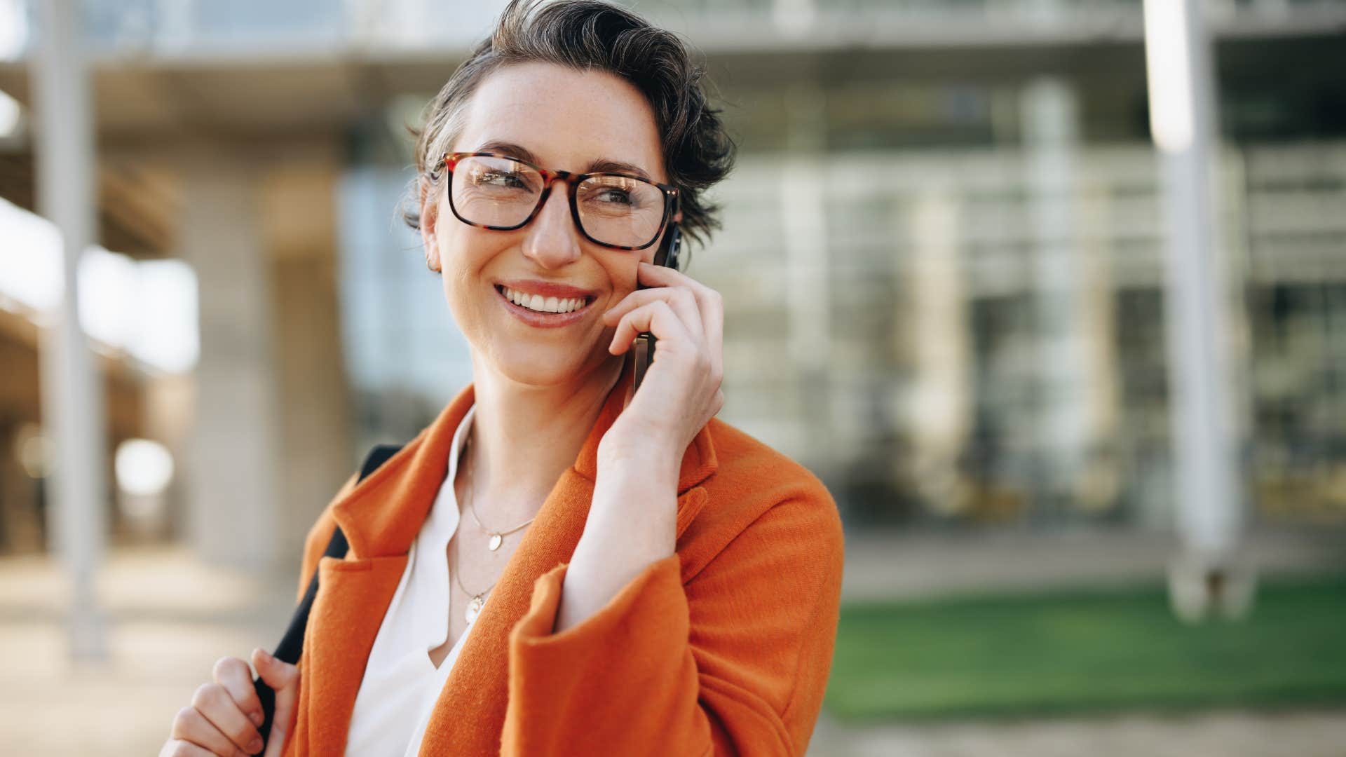 high value woman smiling and talking on the phone