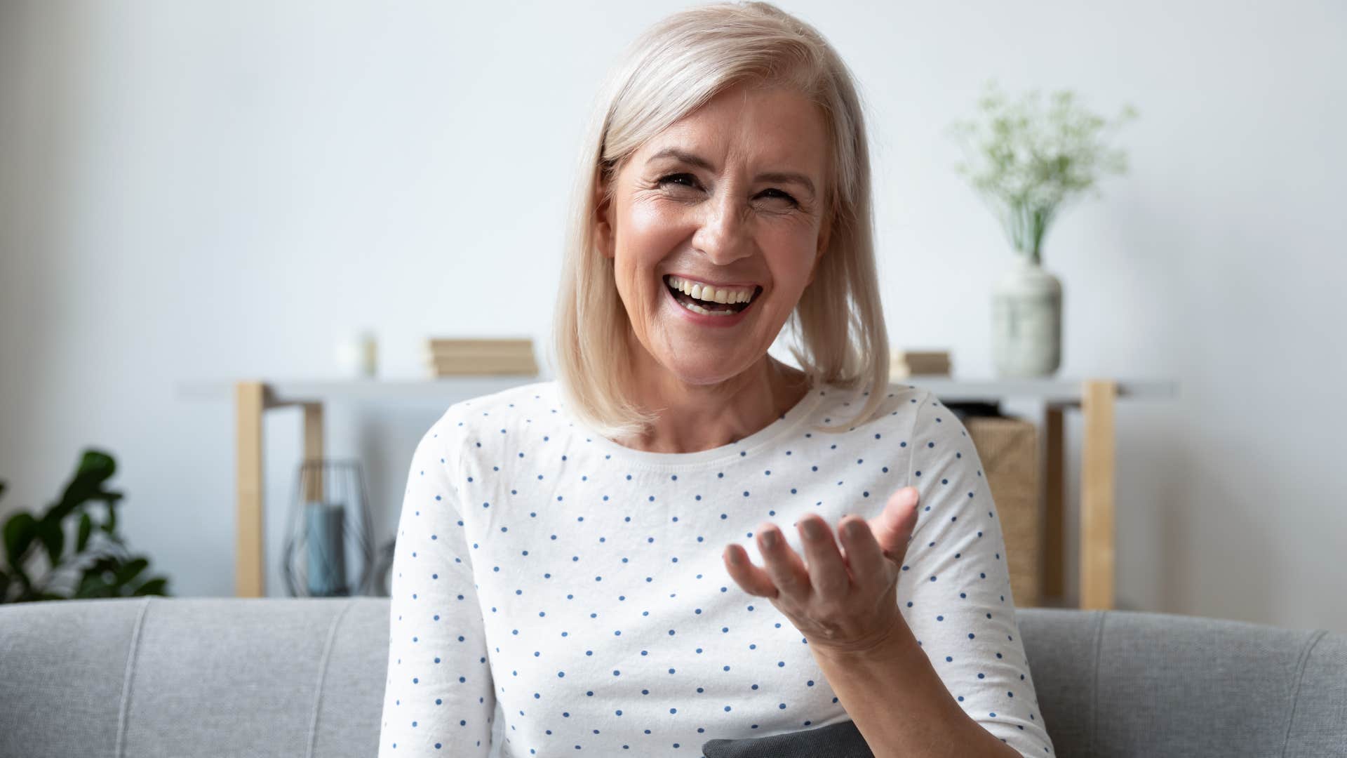 high value woman smiling and talking to someone behind the camera