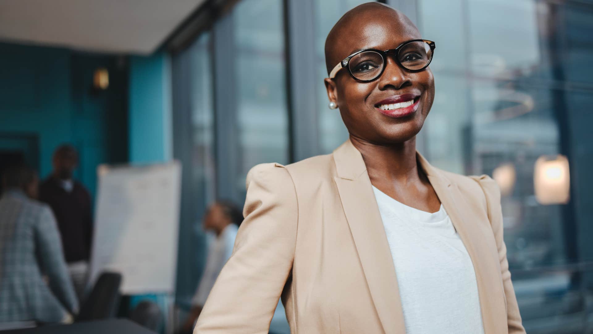 High value professional woman smiling in her office