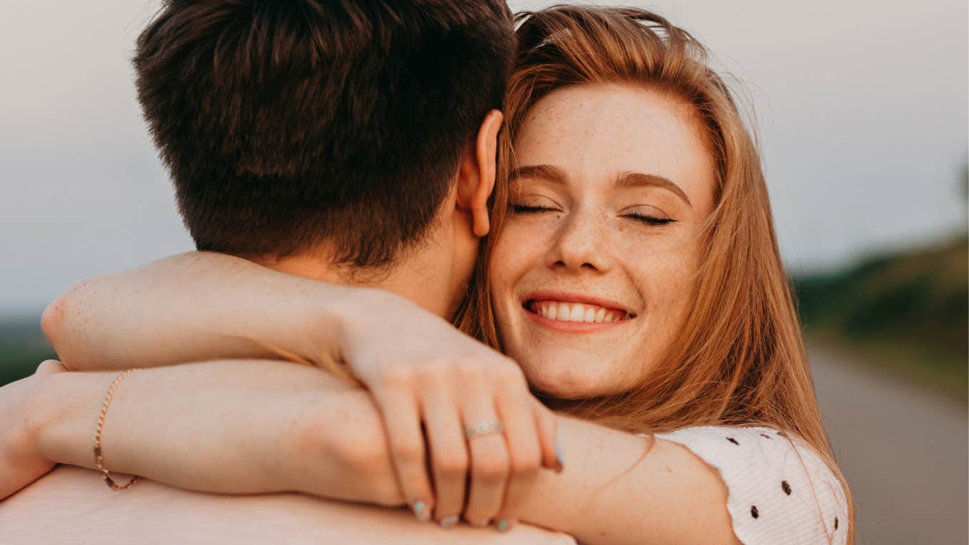 Woman hugging man after giving him a valentine's day surprise