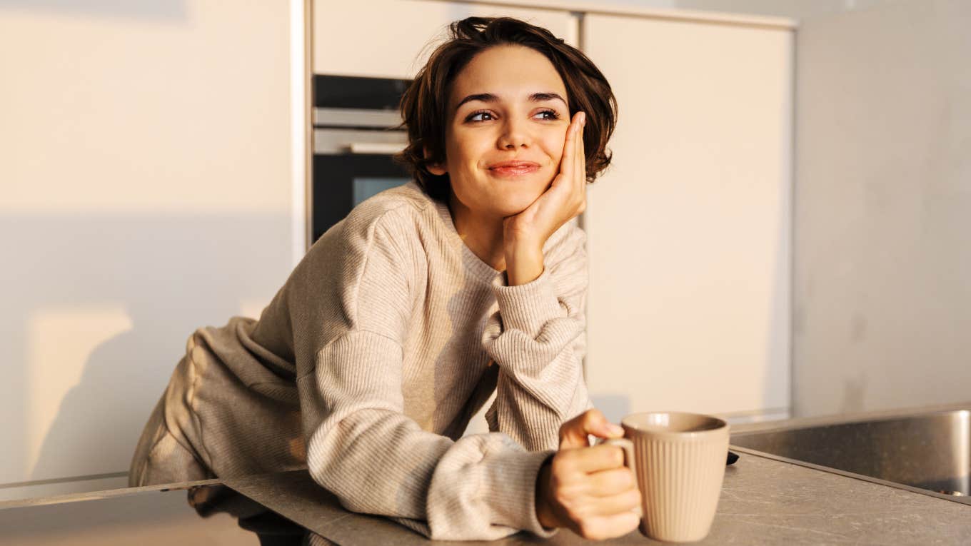 Woman having a peaceful coffee in the morning, becoming wiser. 