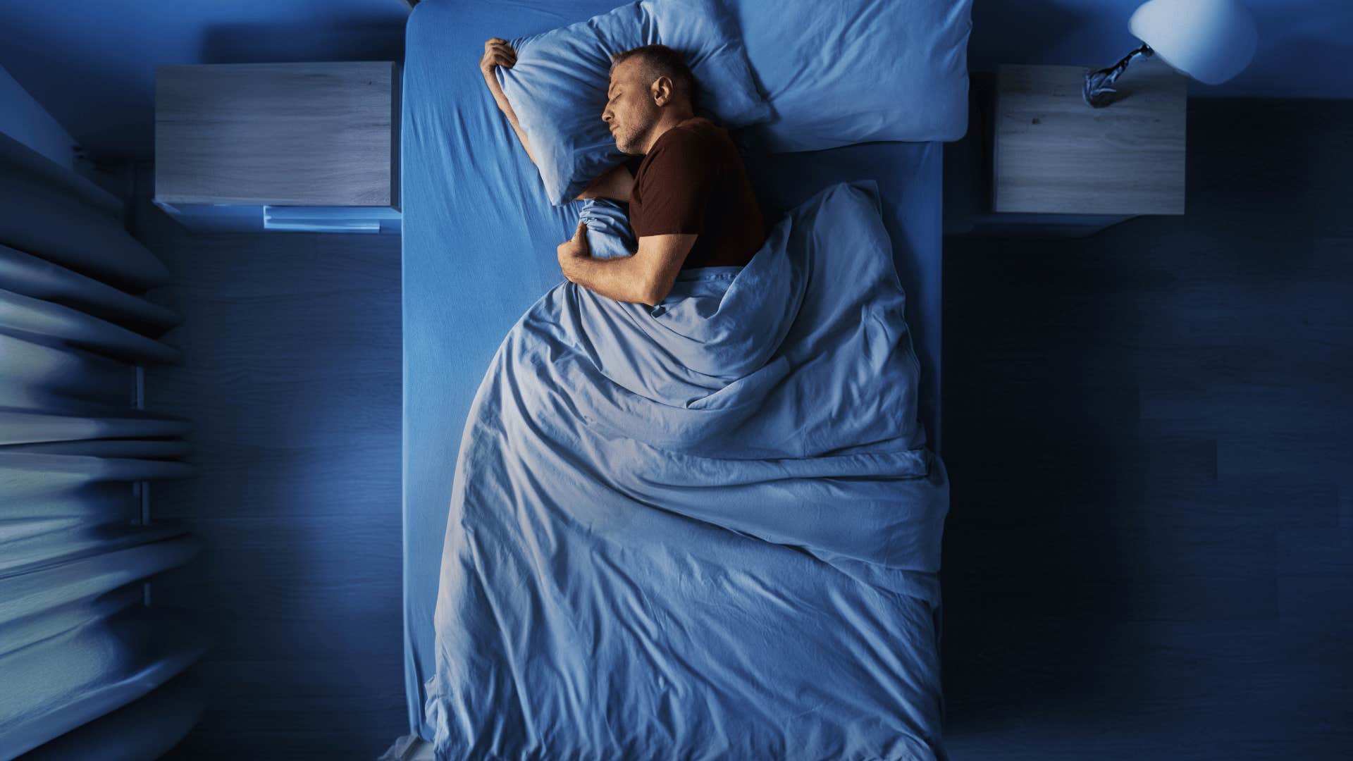 man sleeping in bed