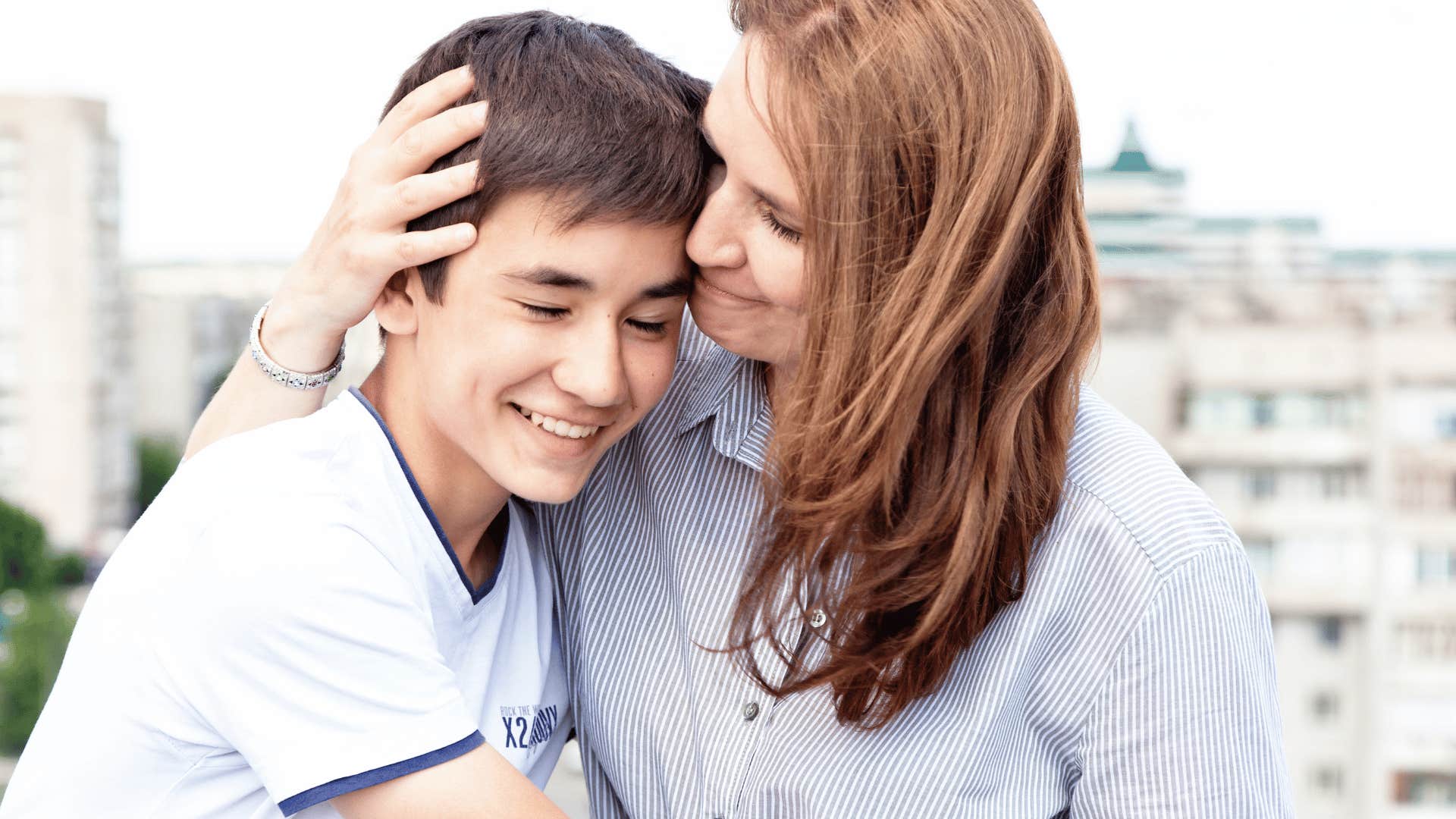 mother hugging son