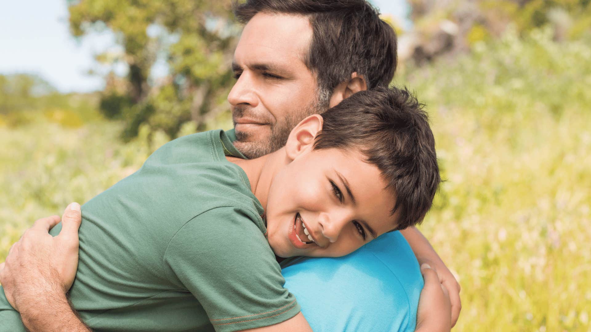 man hugging son