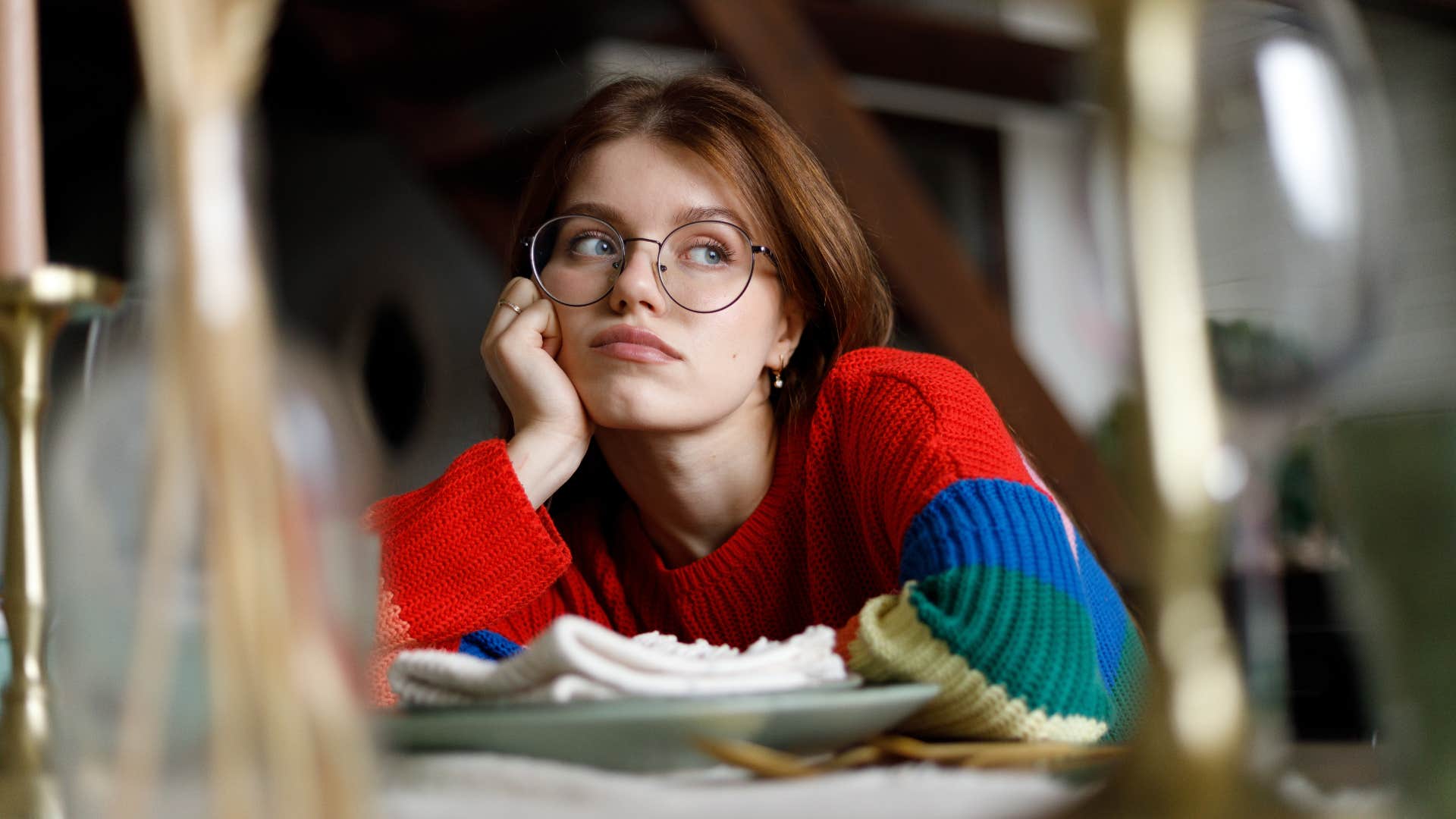 Unhappy woman who automatically said yes to an expensive outing and is experiencing lifestyle creep