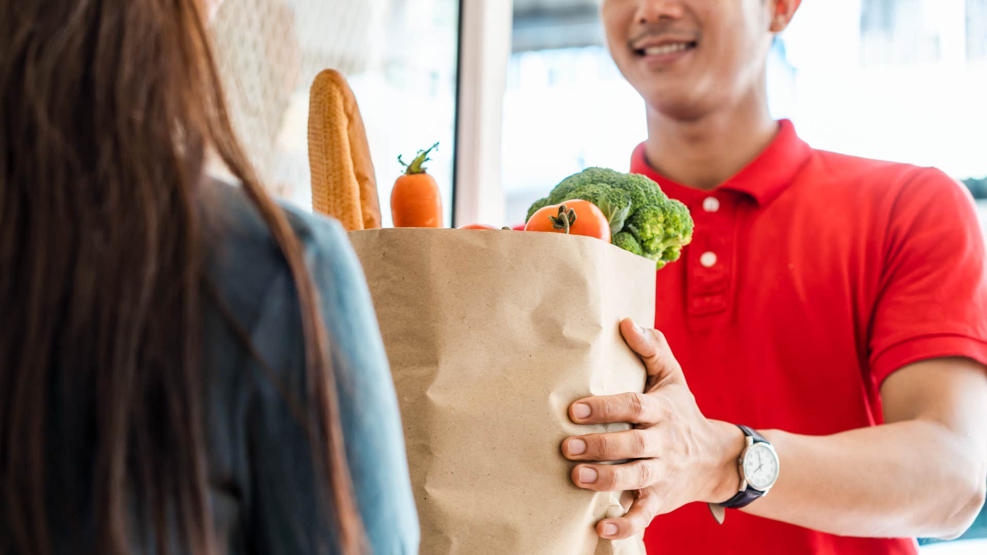 Woman experiencing lifestyle paying more for convenient grocery delivery service