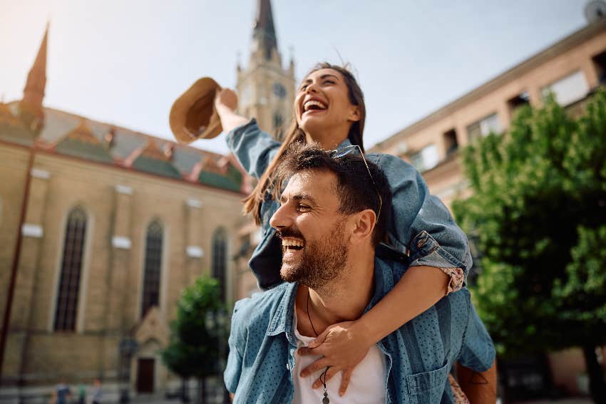 woman on man's back