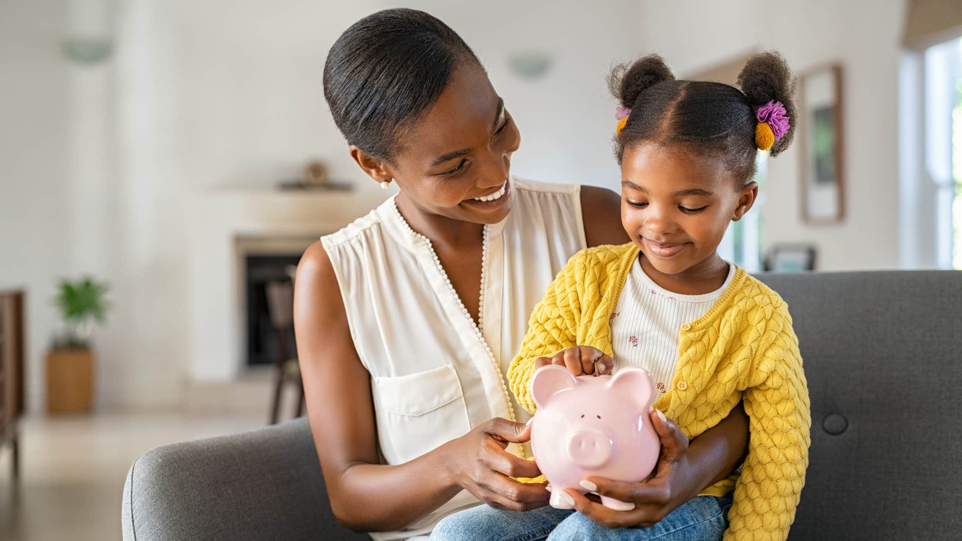 millennial mom teaching daughter finances