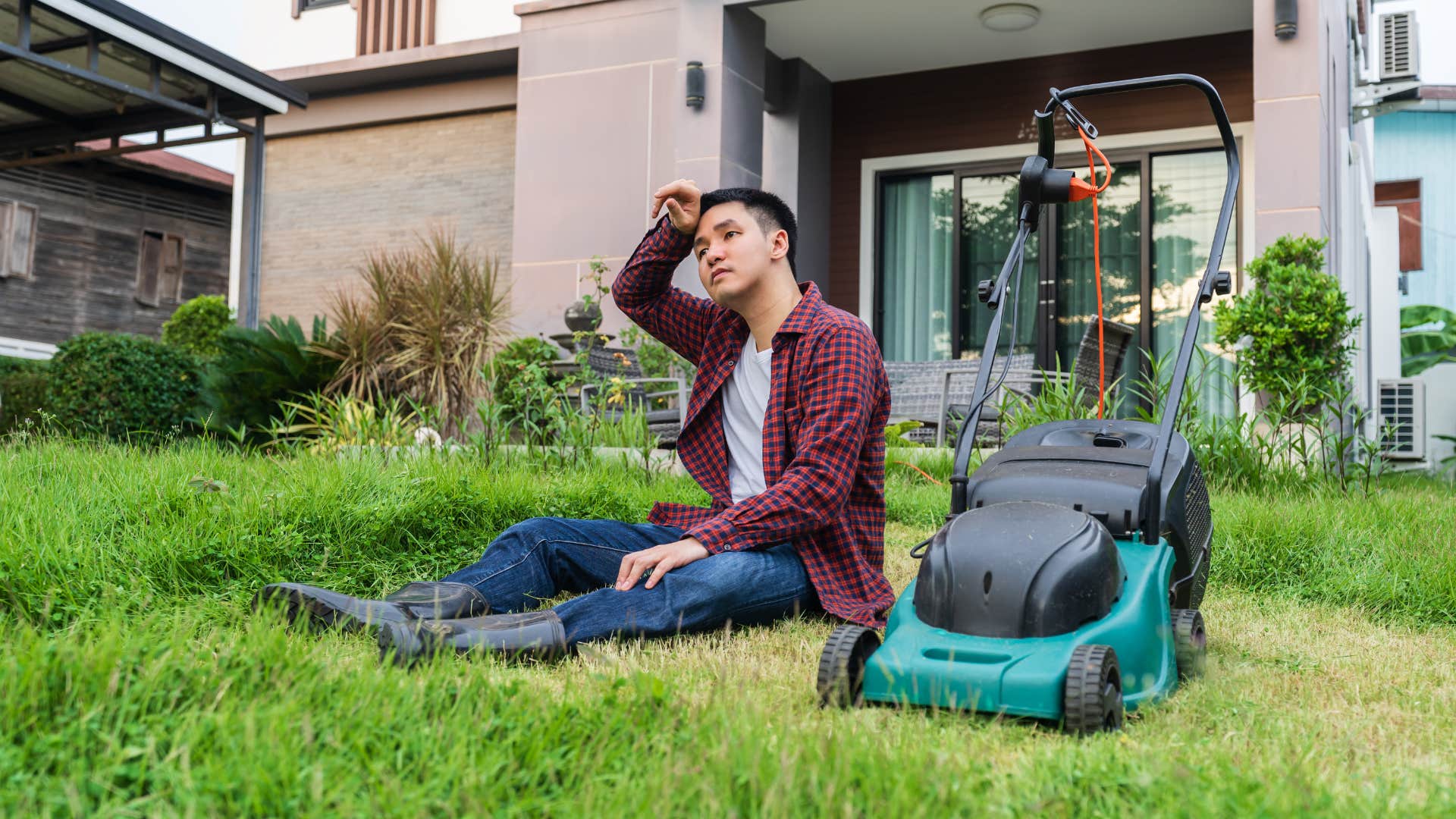 Millennial man wiped out from tending perfect yard like gen x boomer parents