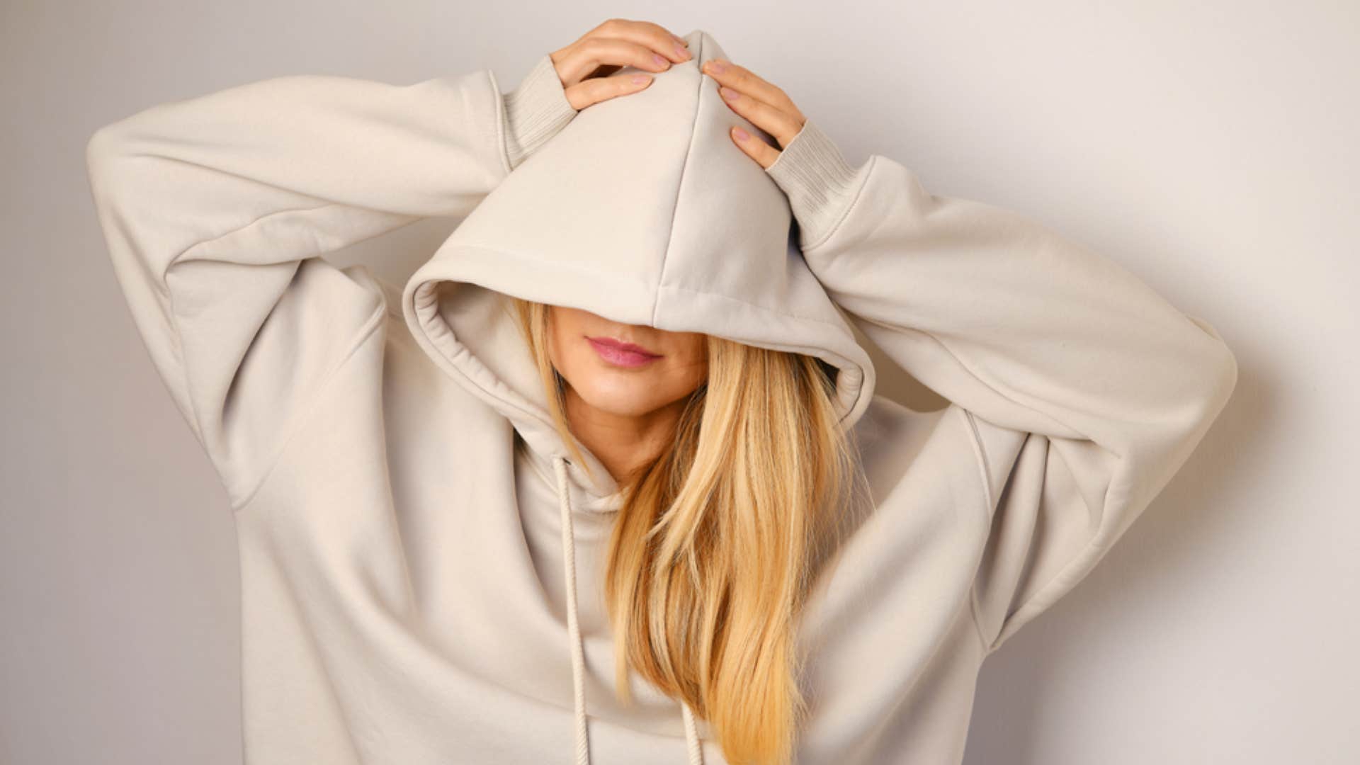 woman wearing oversized sweatshirt