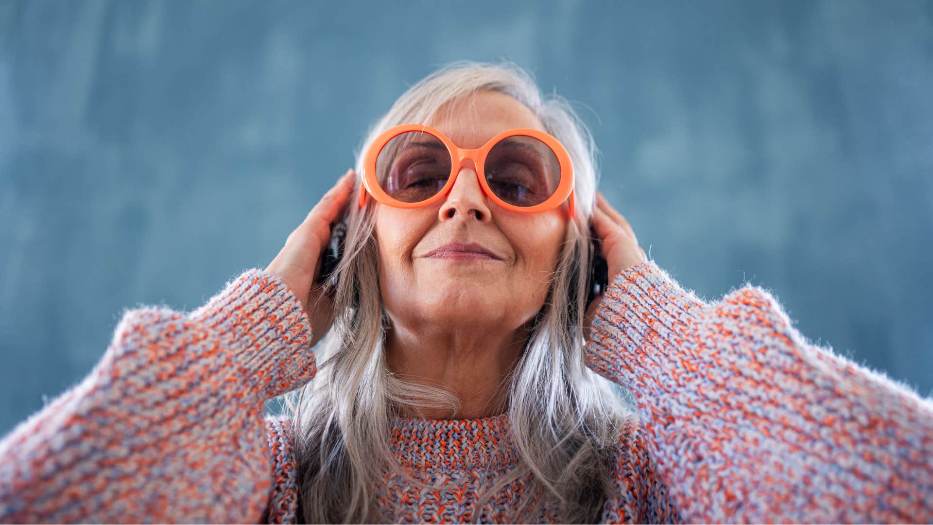 eccentric woman wearing mismatched clothing and glasses