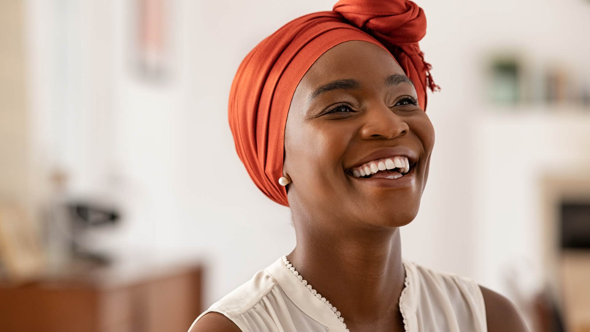 smiling woman with headscarf on