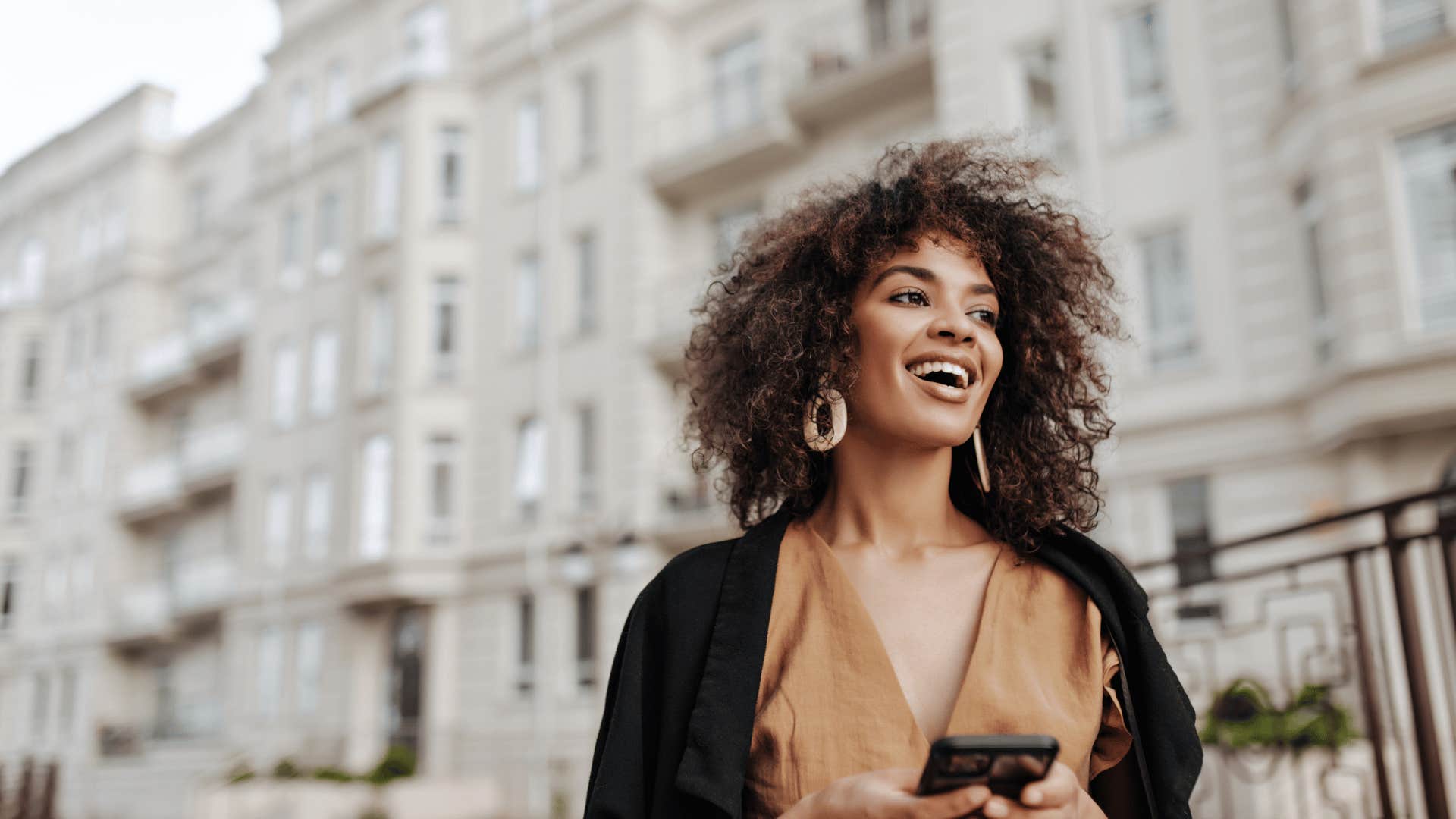 woman smiling in city