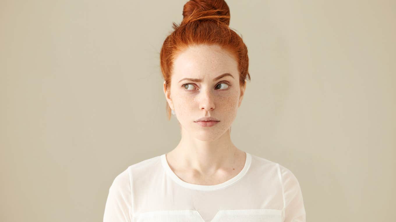 Redhead woman confused over why someone sent a one-word text