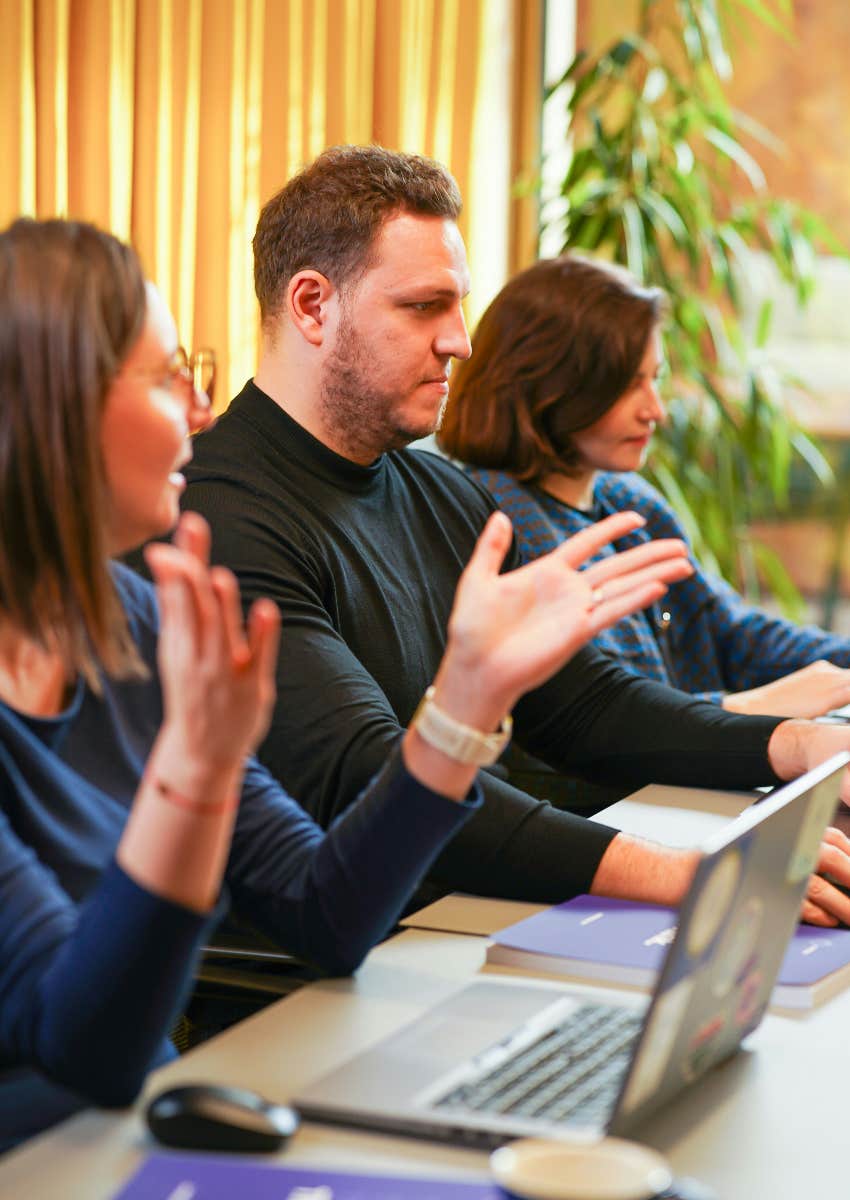 diverse coworkers working together before revoking dei initiatives