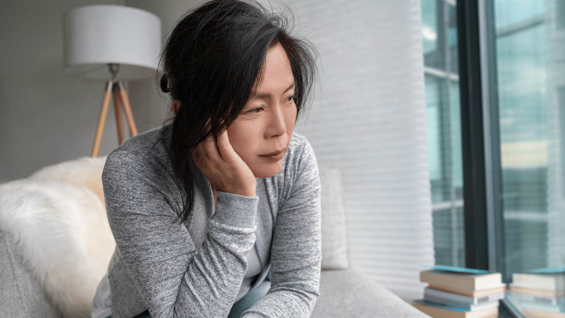 Deep thinking woman feels uncomfortable