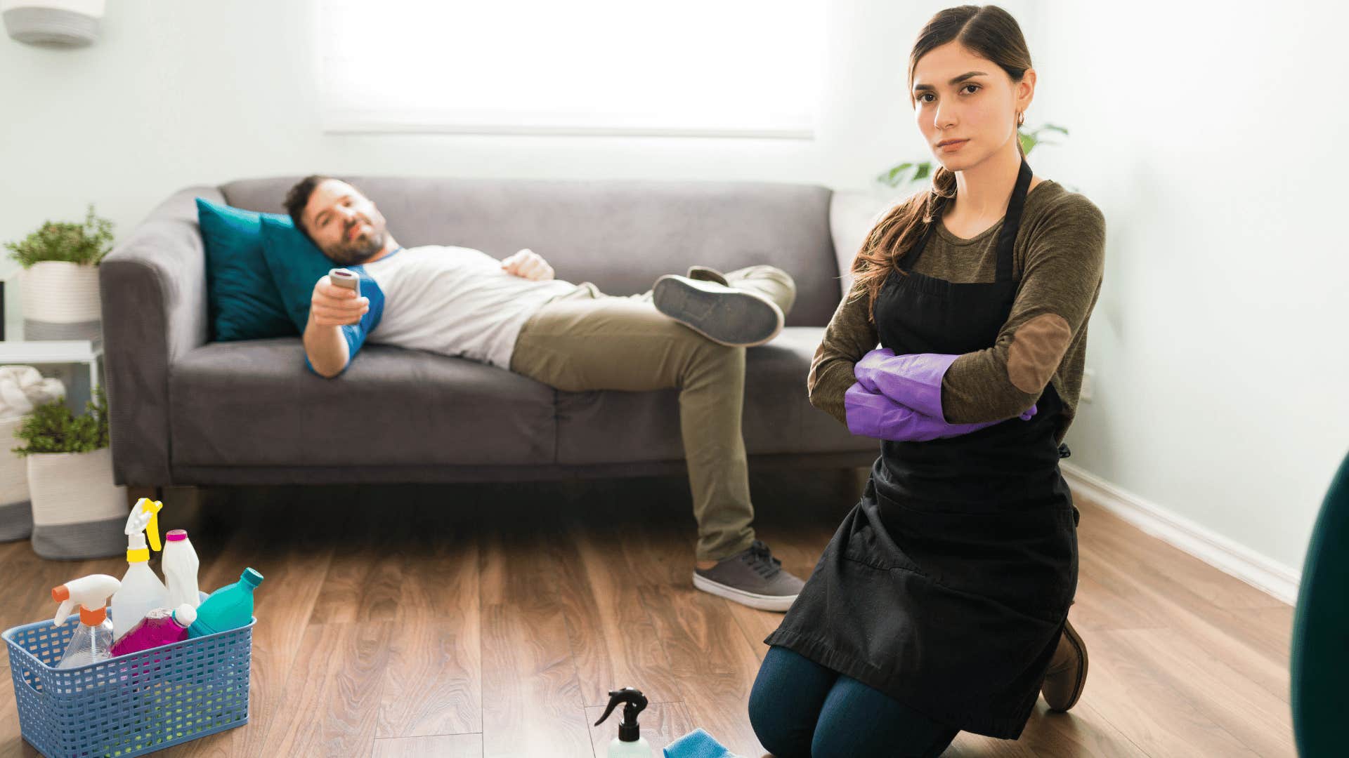 Woman suppresses annoyance about man who won't help clean house