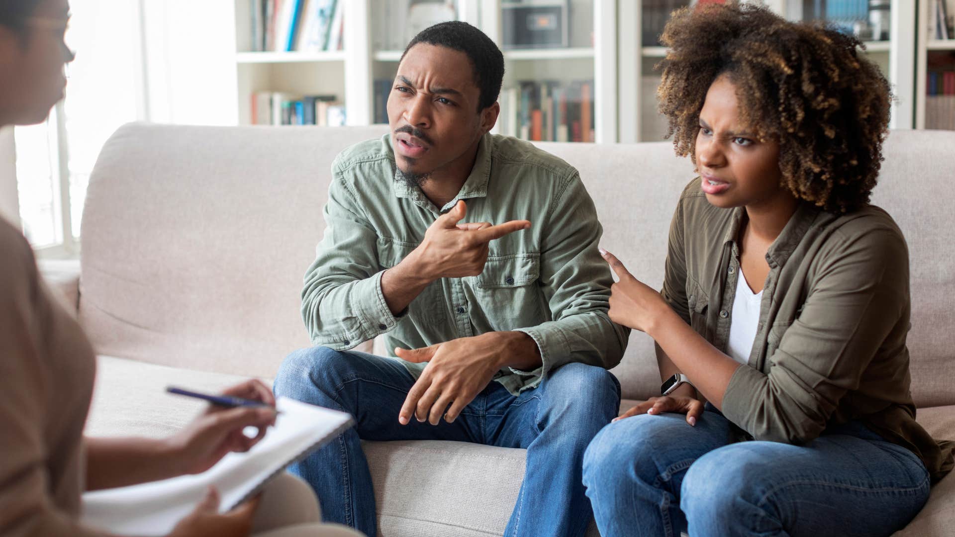 couple arguing in front of therapist