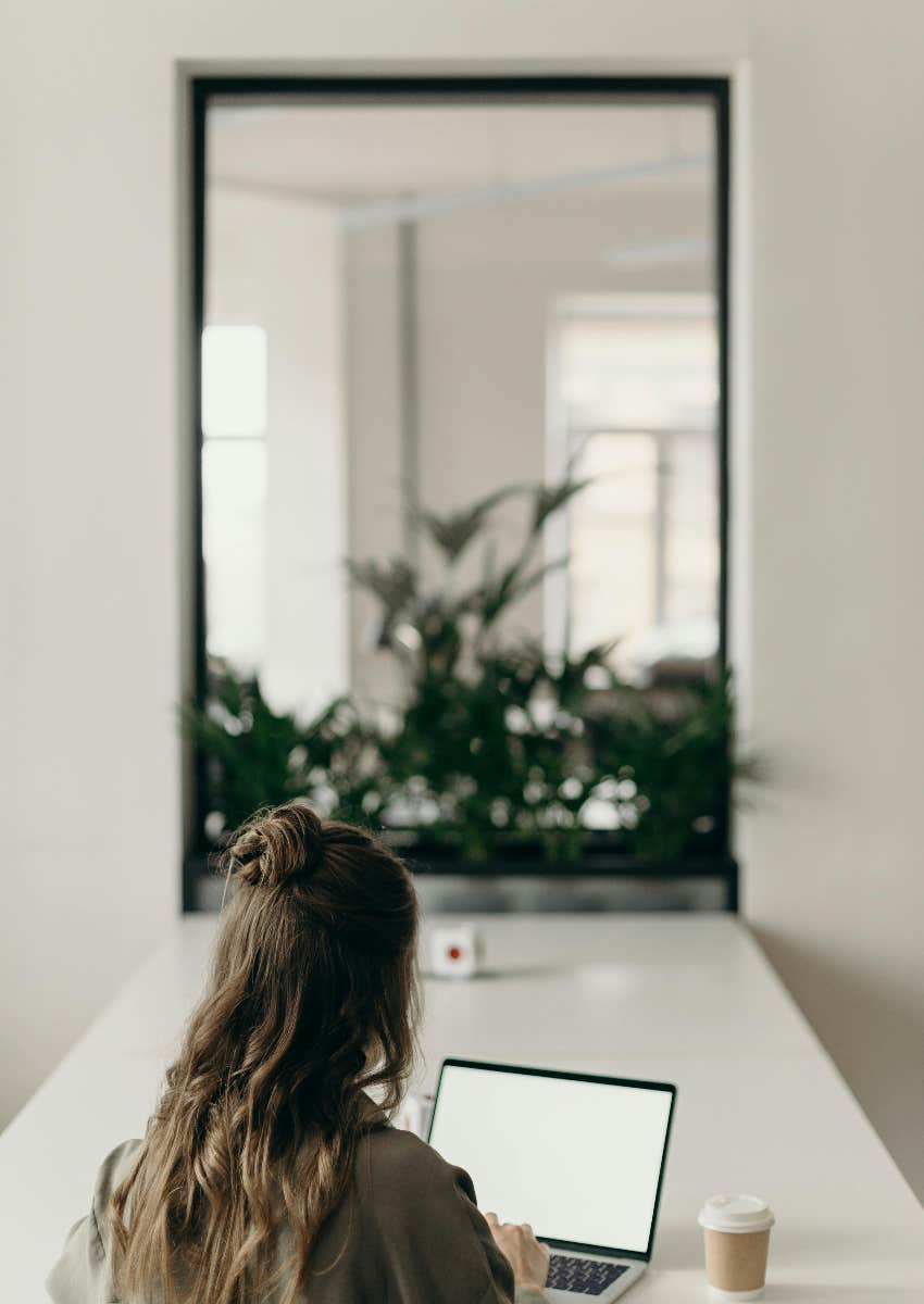 woman on her computer working on job application