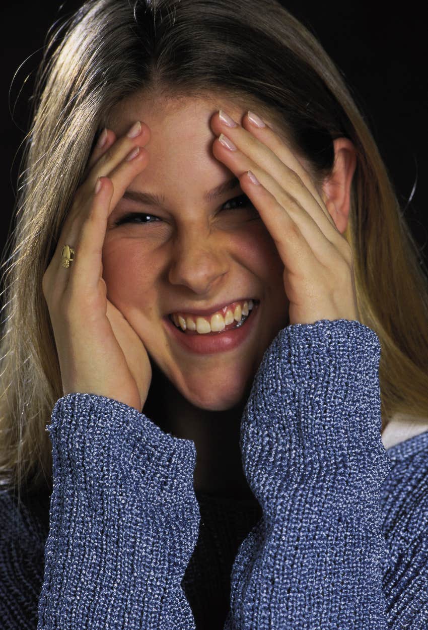 Woman laughing after being embarrassed by mispronouncing words