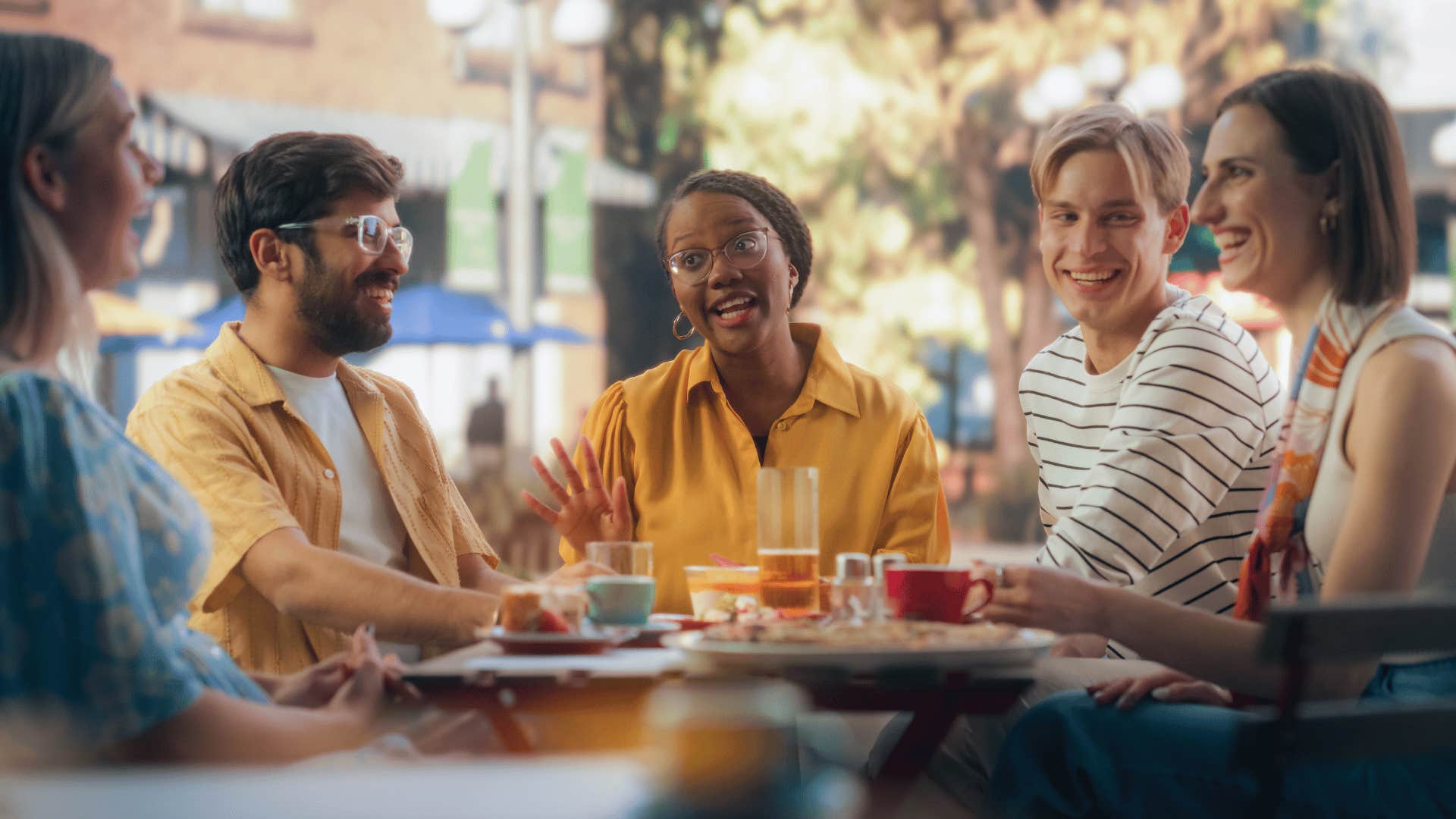 woman telling a story to group of friends