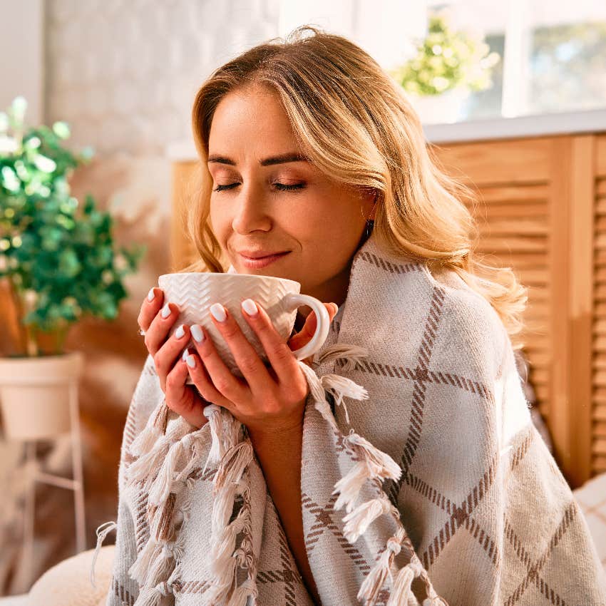 Woman in cozy bedroom with good Feng Shui