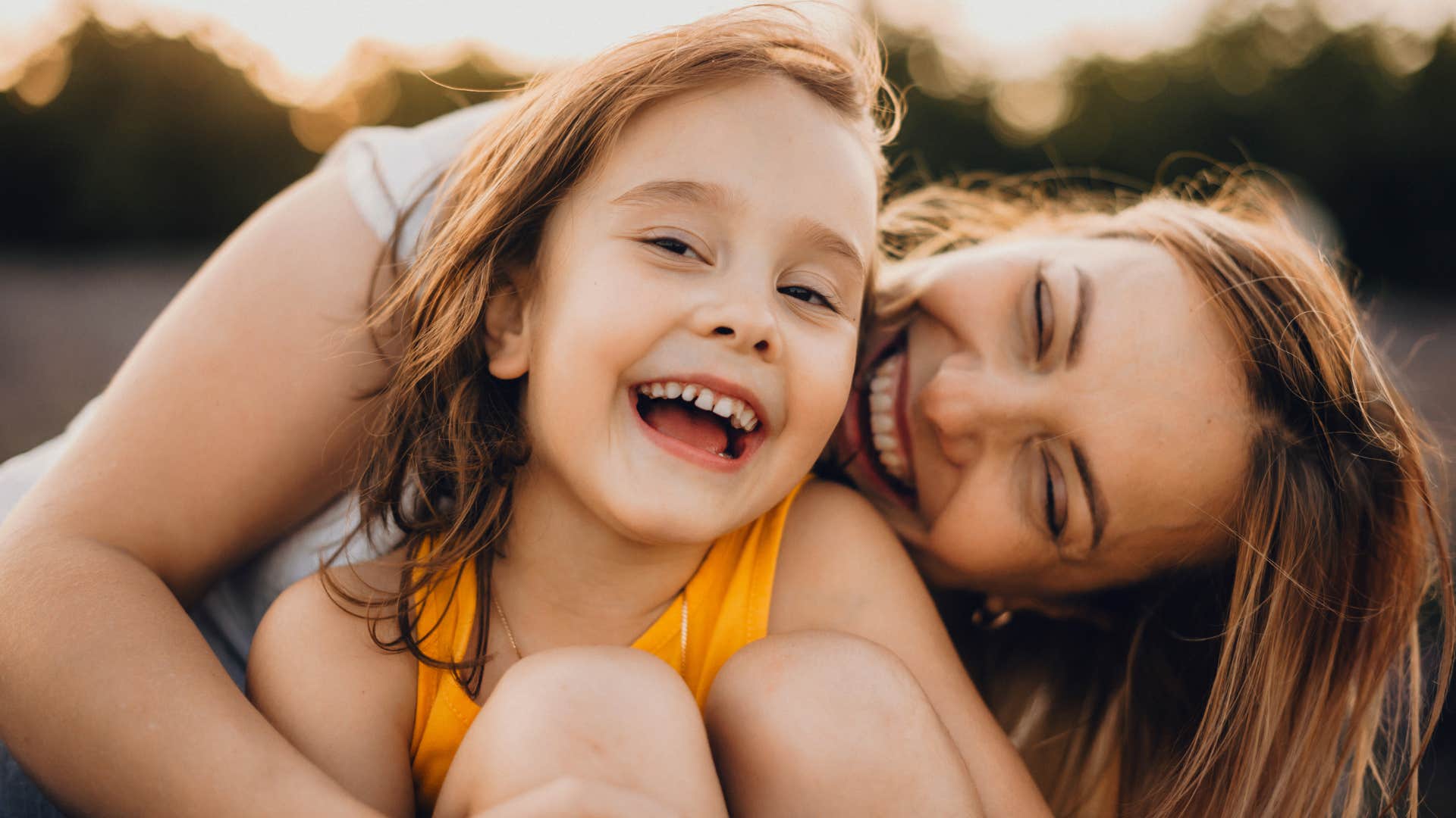 Charming mother telling her daughter You can do anything you want.