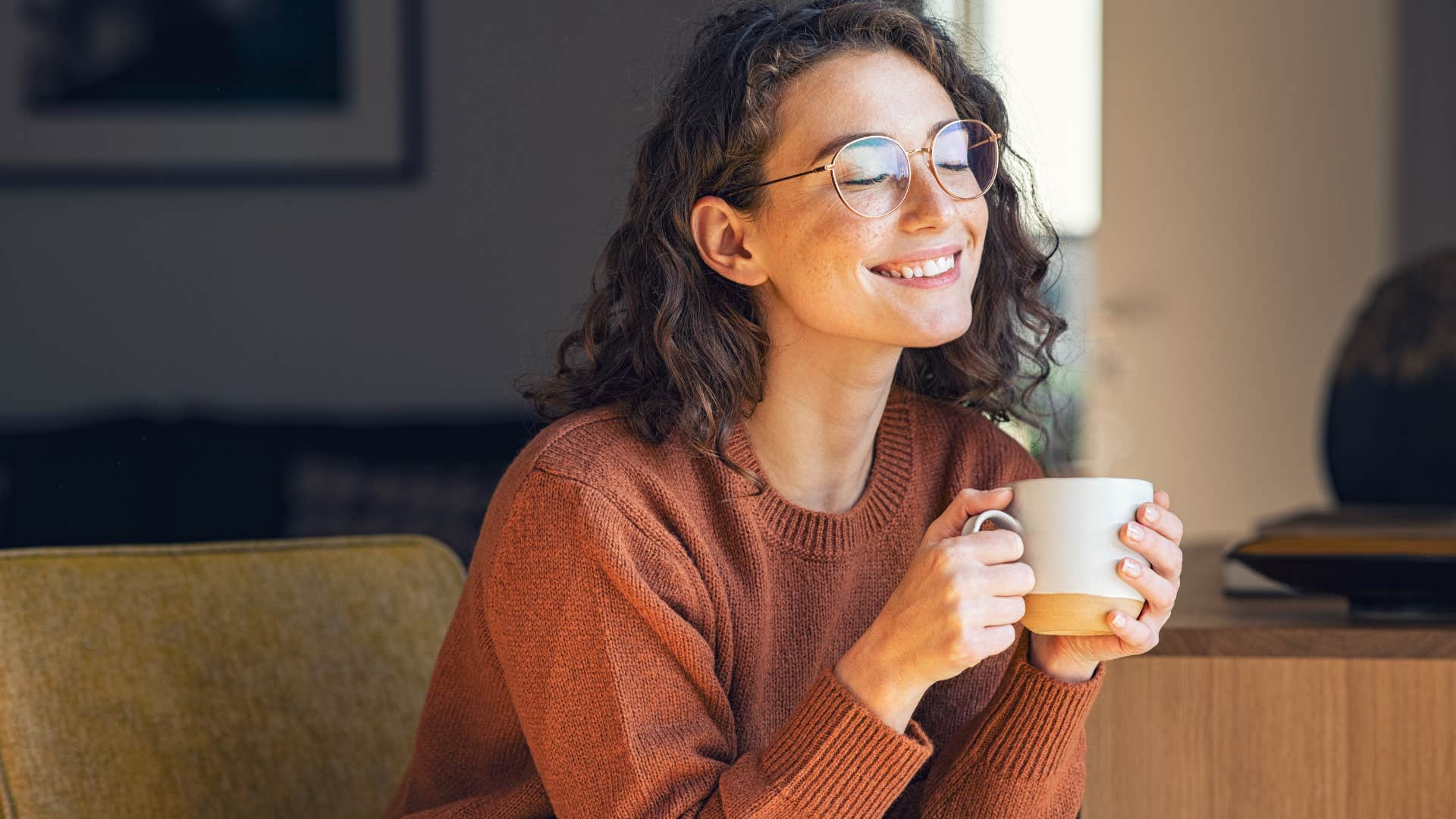 Woman smiling and daydreaming