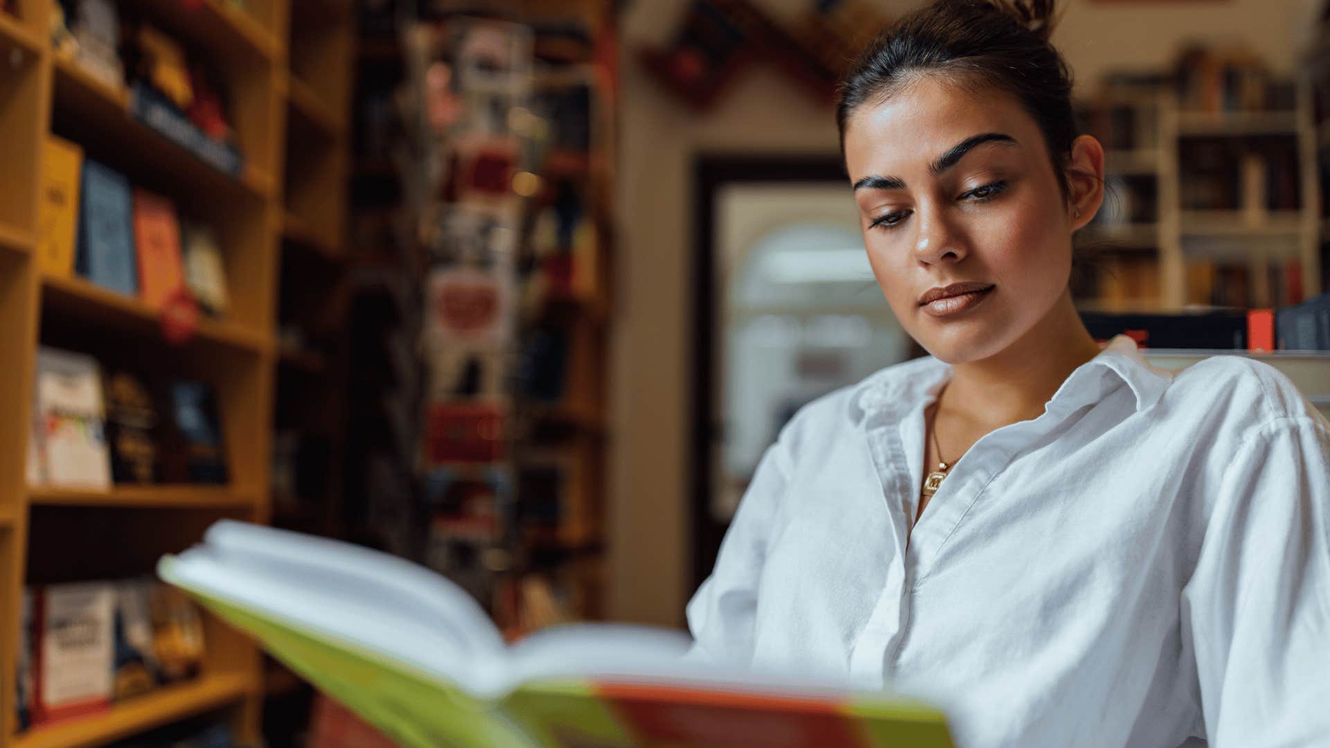 woman learning something new from a book